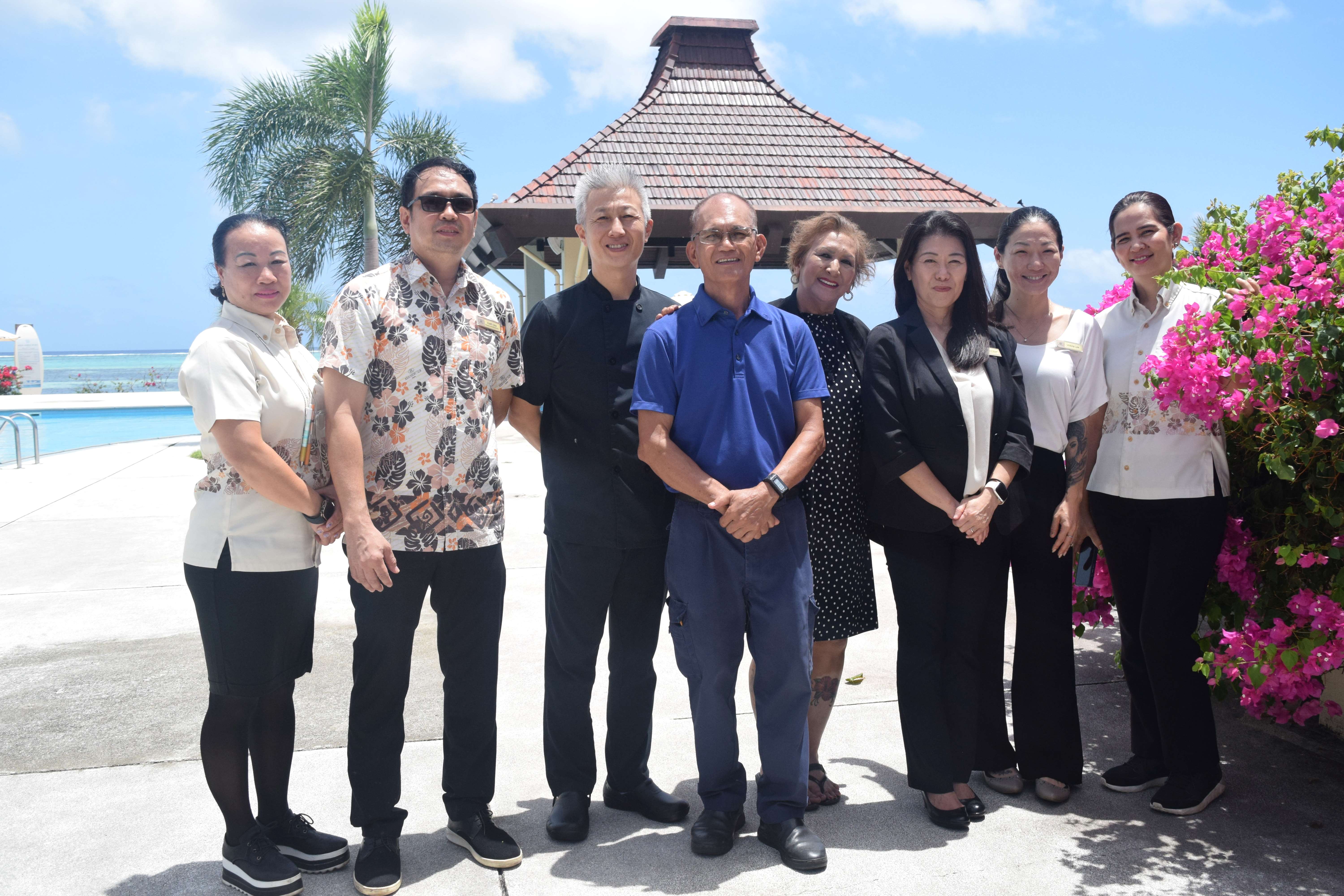 Aqua Resort Club General Manager Sachiko N. Gerrard, third right, is joined by Human Resource Manager Becky Cruz, fourth right; Executive Chef Inok Lee, third left;  Marketing & Public Relations Assistant Manager Victoria S. Barnes, second right; Food & Beverage Manager Marie Ann Razon-Isip, rightmost; Chief Engineer Jimmy Magboo, center; Restaurant Supervisor Keith Isip, second left; and front desk team member Angel Cabrera, leftmost, on Wednesday last week. 