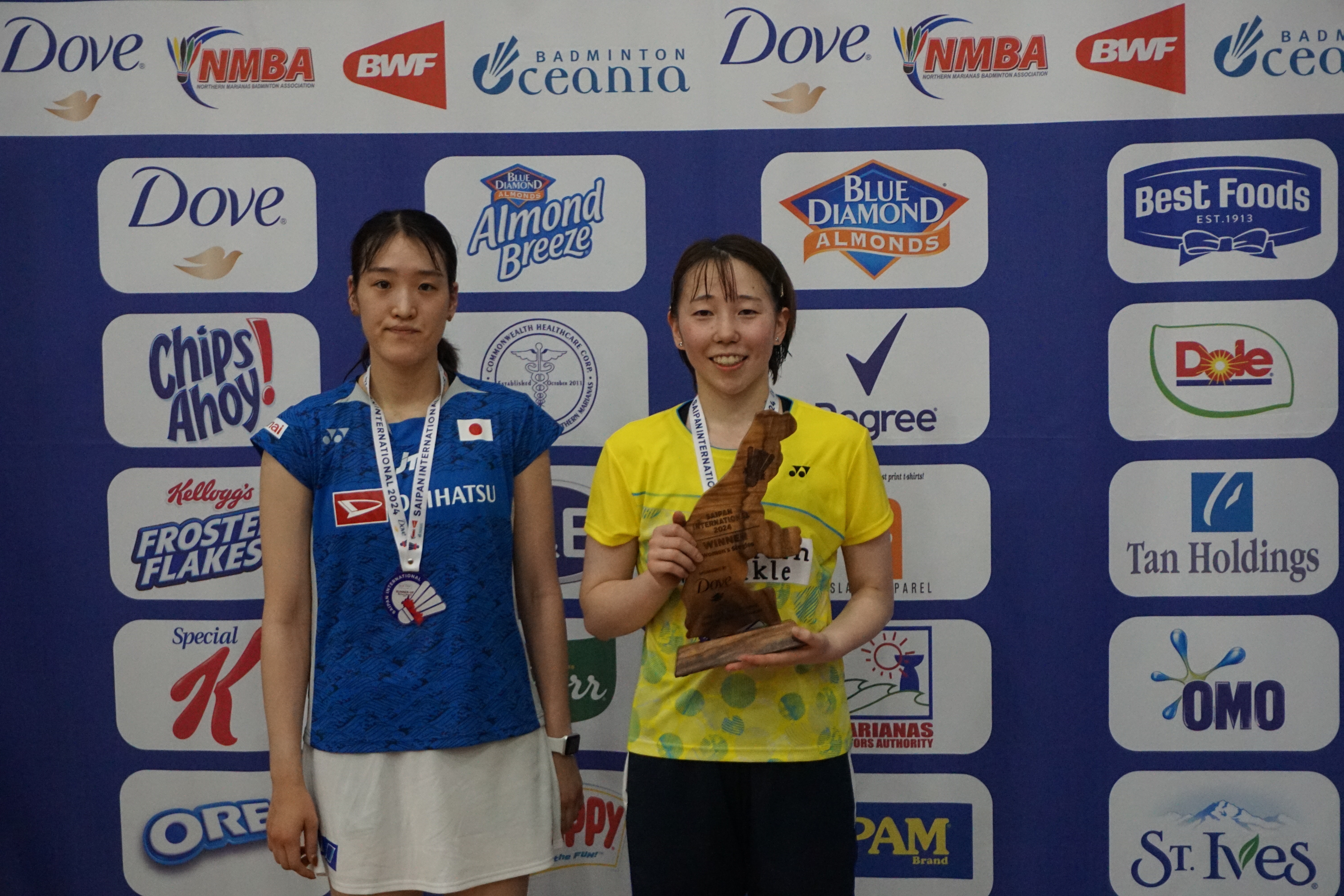 Women's singles finalists Asuka Takahashi and Riko Gunji pose for a photo during the awards ceremony of the Dove Saipan International 2024 at the Ada gym on Saturday.
