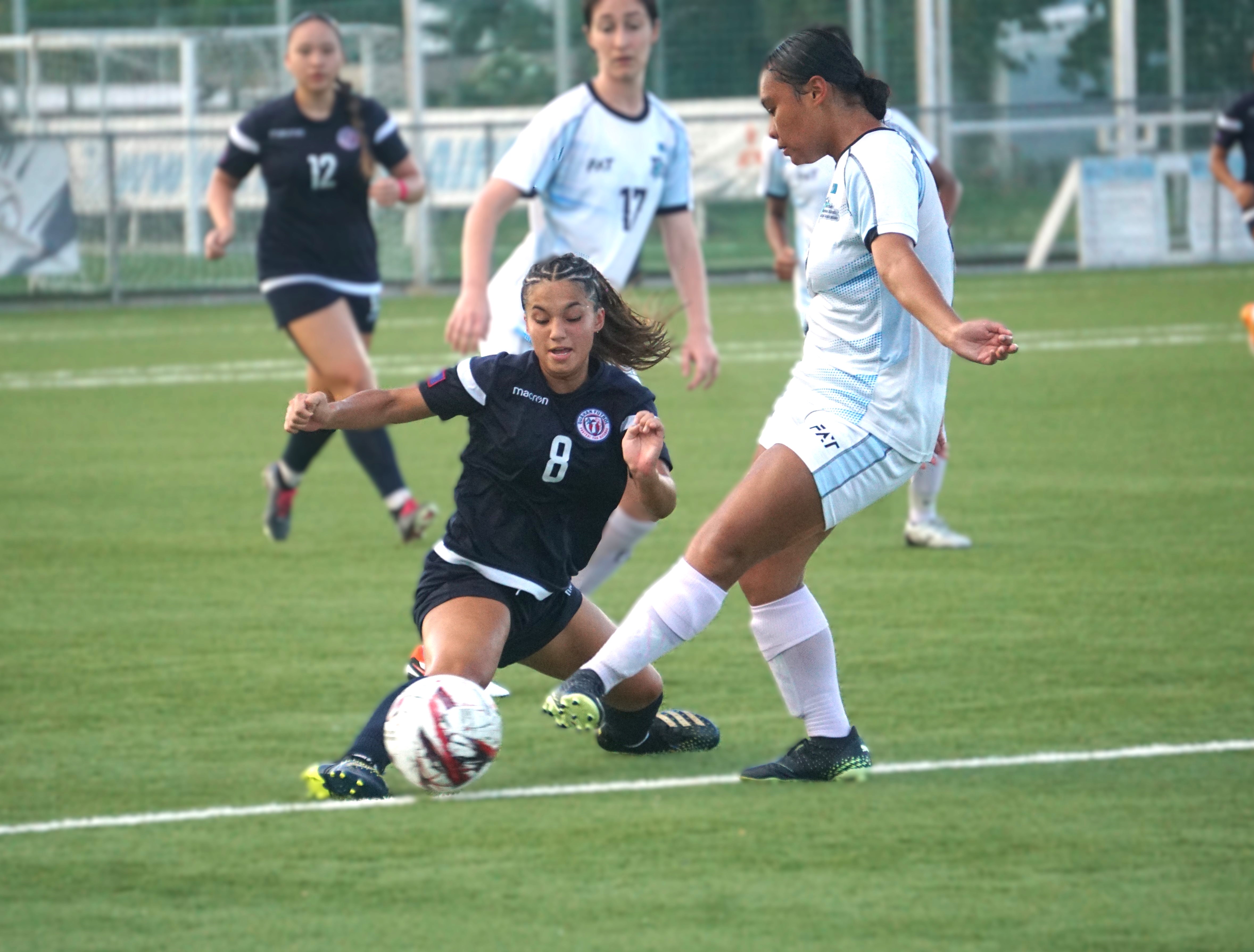 Guam's Olivia Haddock attempts the interception against the NMI's Christina Atalig during a match of the NMIFA U21 Women's Three Nations Cup 2024 at the NMI Soccer Training Center on Sunday.
