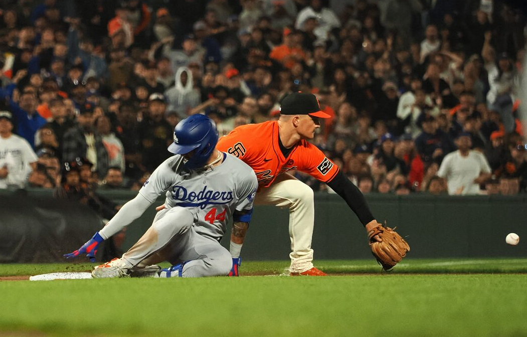 Los Angeles Dodgers center fielder Andy Pages (44) reaches third base against San Francisco Giants third baseman Matt Chapman (26) on a triple during the ninth inning at Oracle Park in San Francisco, California, June 28, 2024.