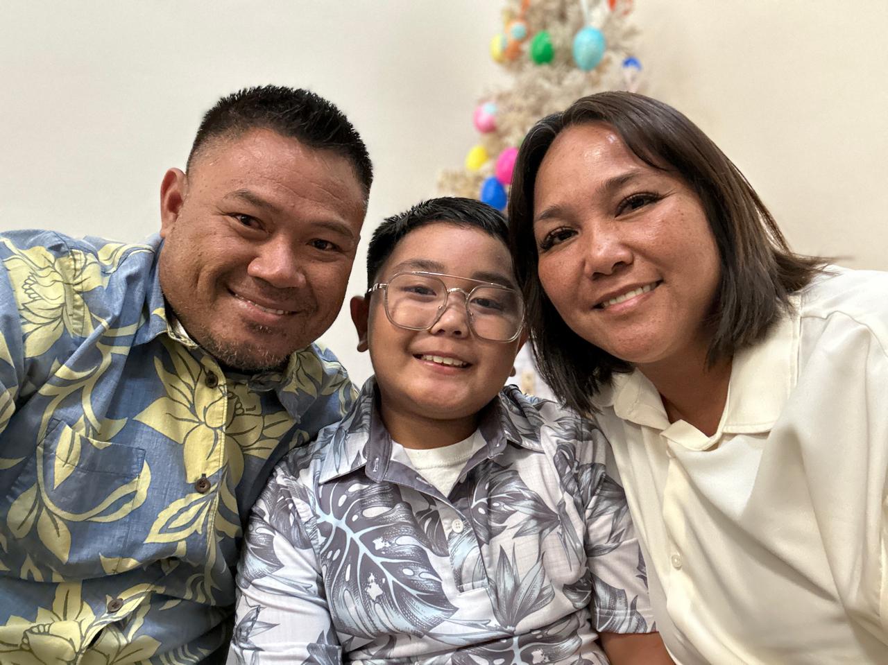 Fred Salavaria with his wife and son.