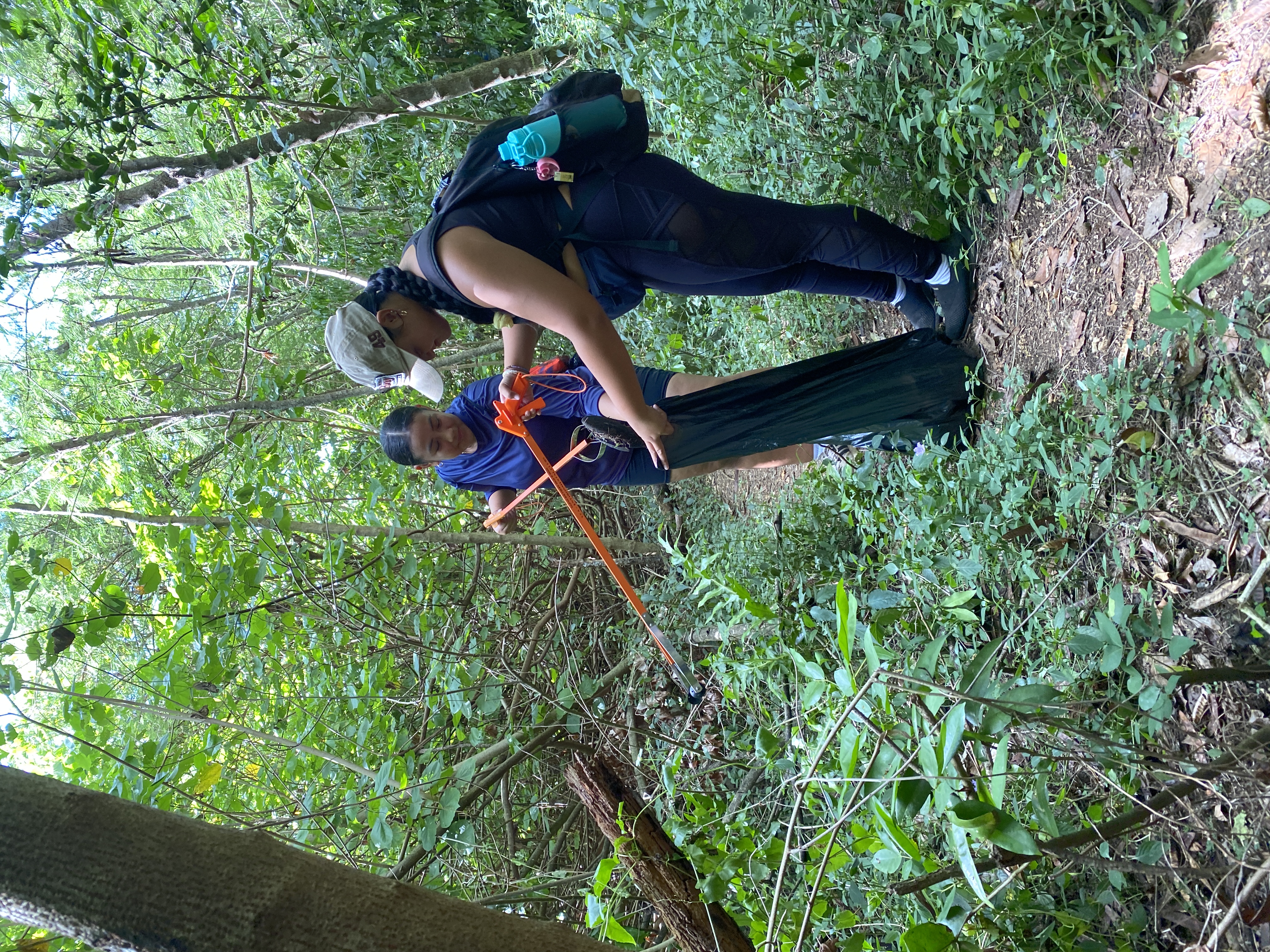 Two volunteers ensured that the trail was left better than they found it during the beach cleanup on Saturday.