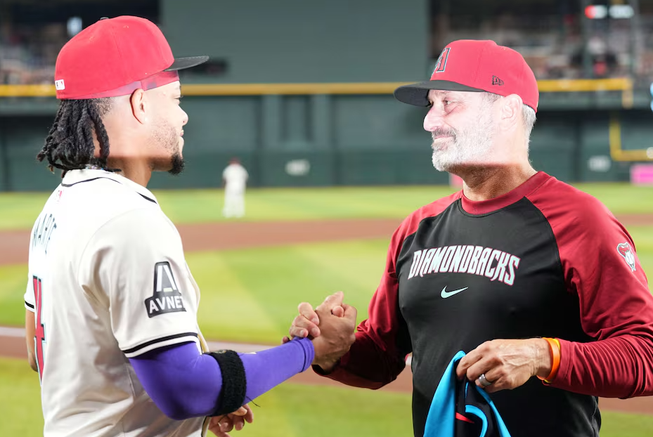 Arizona Diamondbacks manager Torey Lovullo (17) congratulates Arizona Diamondbacks second base Ketel Marte (4) on his selection to the MLB All-Star game prior the game against the Toronto Blue Jays at Chase Field in Phoenix, Arizona,  July 13, 2024.