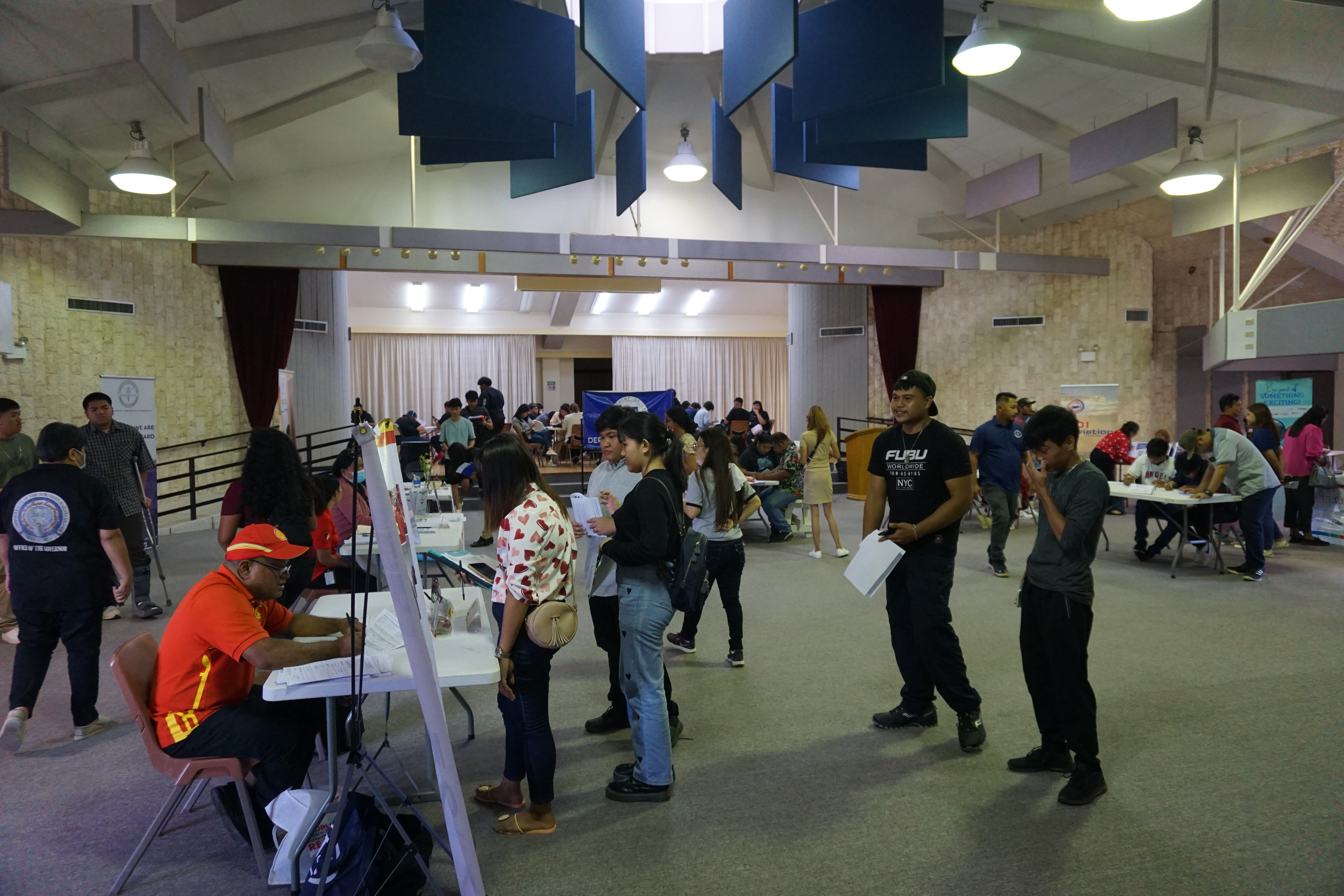 Dozens of residents look for job opportunities at the CNMI DOL Job Fair on Friday, June 28​.
