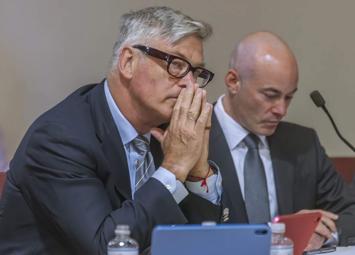 Actor Alec Baldwin, left, sits with his lawyer Luke Nikas in District Court, Sante Fe., N.M., Monday, July 8 during a preliminary hearing in his involuntary manslaughter trial over a fatal shooting on the set of the film, “Rust.”