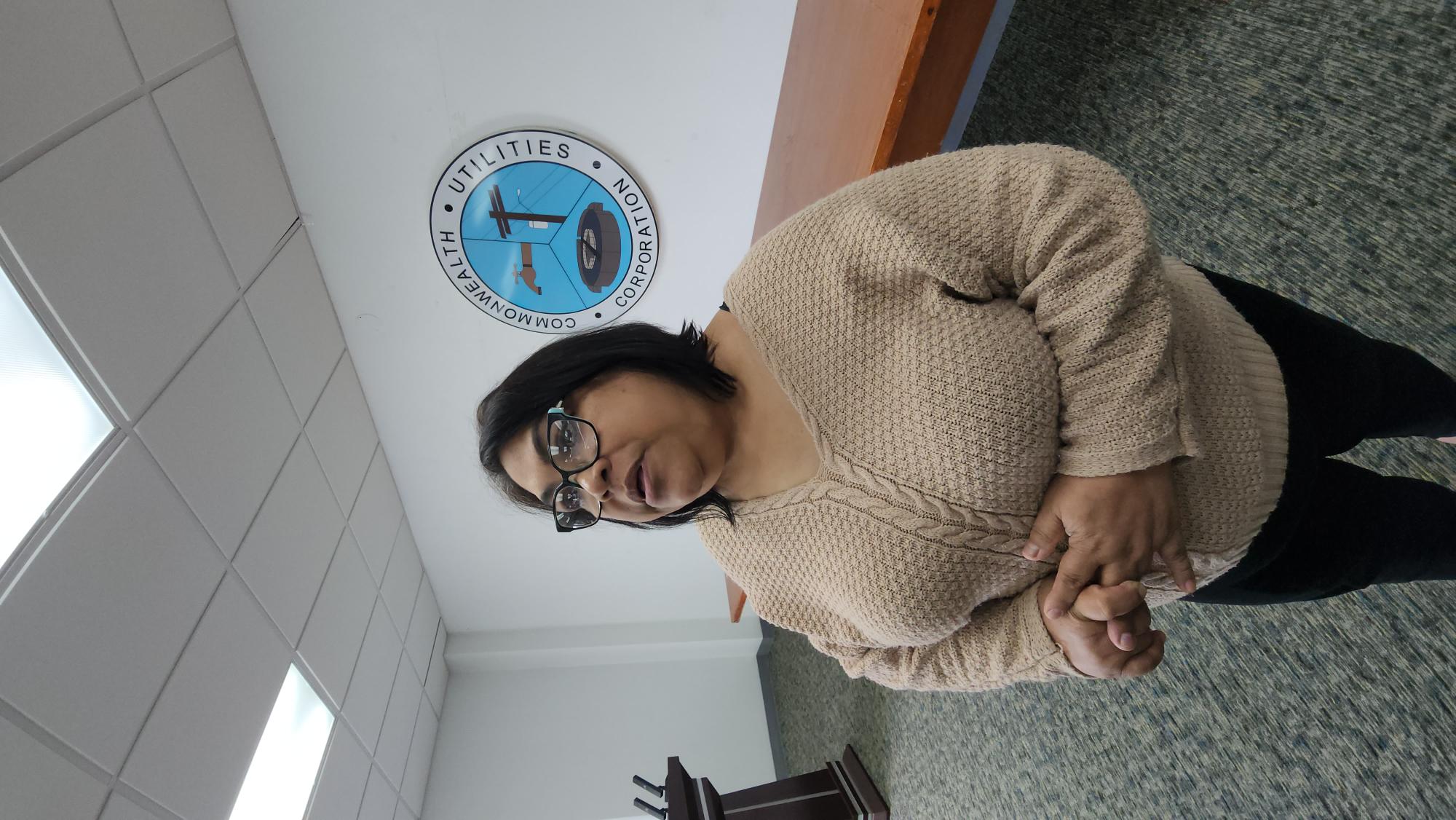 Commonwealth Utilities Corp. Board Chair Janice Tenorio speaks to reporters after the CUC board unanimously approved to offer the CFO’s position to “applicant number two.”