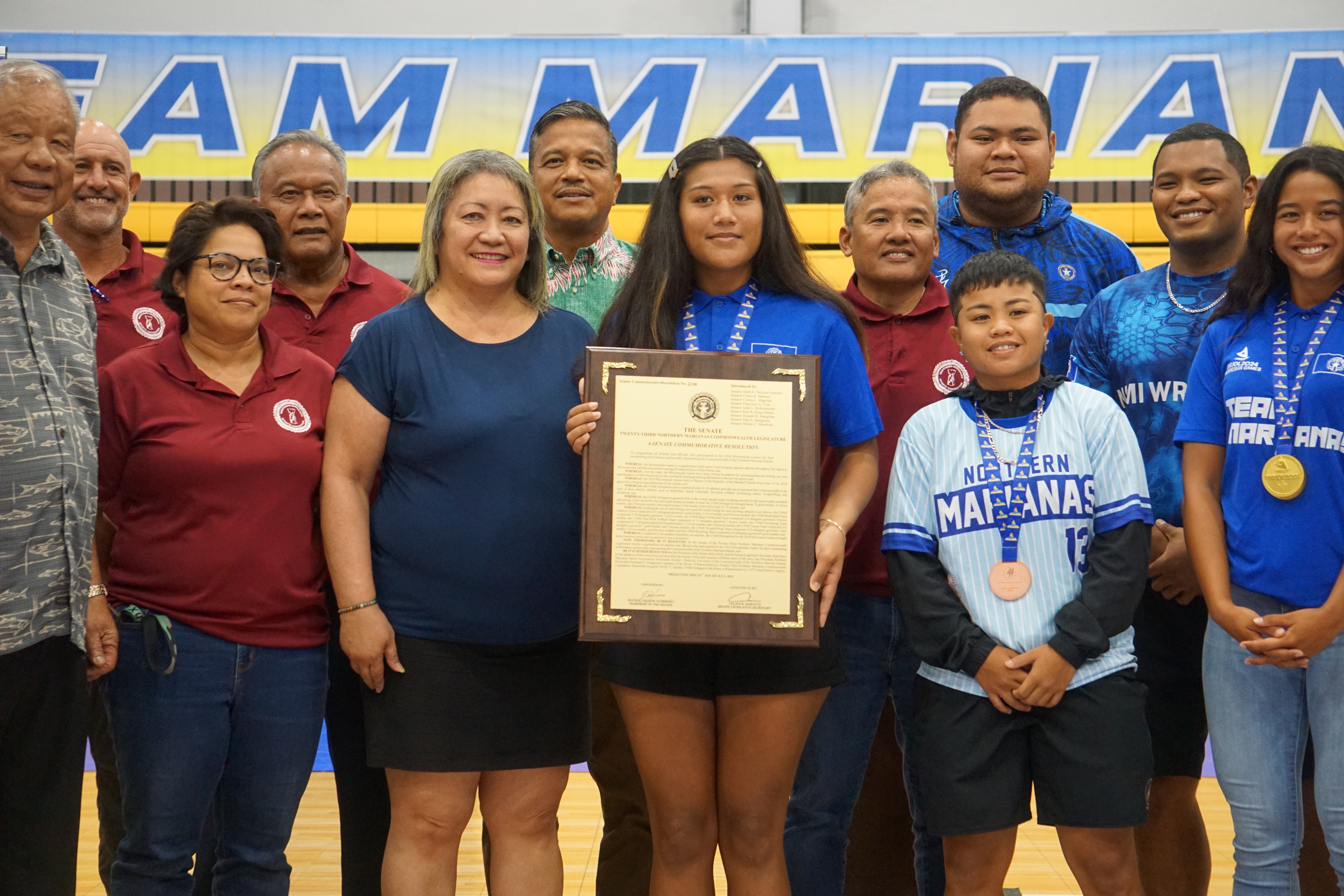 During the Appreciation Night hosted by the Northern Marianas Sports Association at the Ada gym on Tuesday, Senate President Edith Deleon Guerrero presented a framed copy of a Senate commemorative resolution honoring the Team Marianas athletes who participated in the 2024 Micronesian Games in Majuro, the Marshall Islands last month.