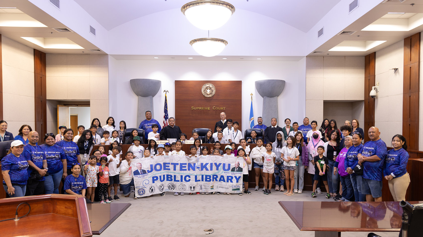 Joeten-Kiyu Public Library reading program participants and JKPL staff pose with CNMI justices at Guma’ Hustisia.
