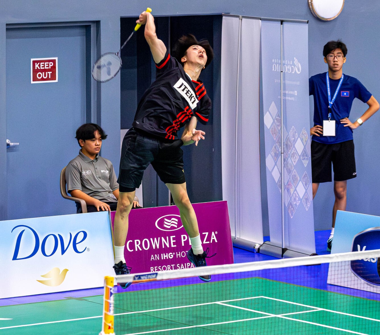 Japan's Tori Aizawa leaps for the smash return during a men's doubles match of the Dove Saipan International 2024 at the Ada gym.