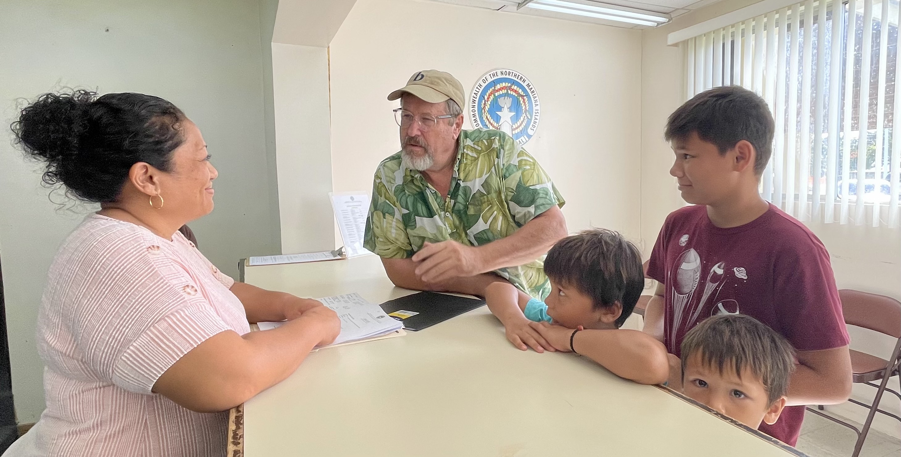 Del Benson is joined by his grandsons Jade, Bo and Ande in filing his candidacy for the House Representatives at the Commonwealth Election Commission in Susupe on Wednesday.