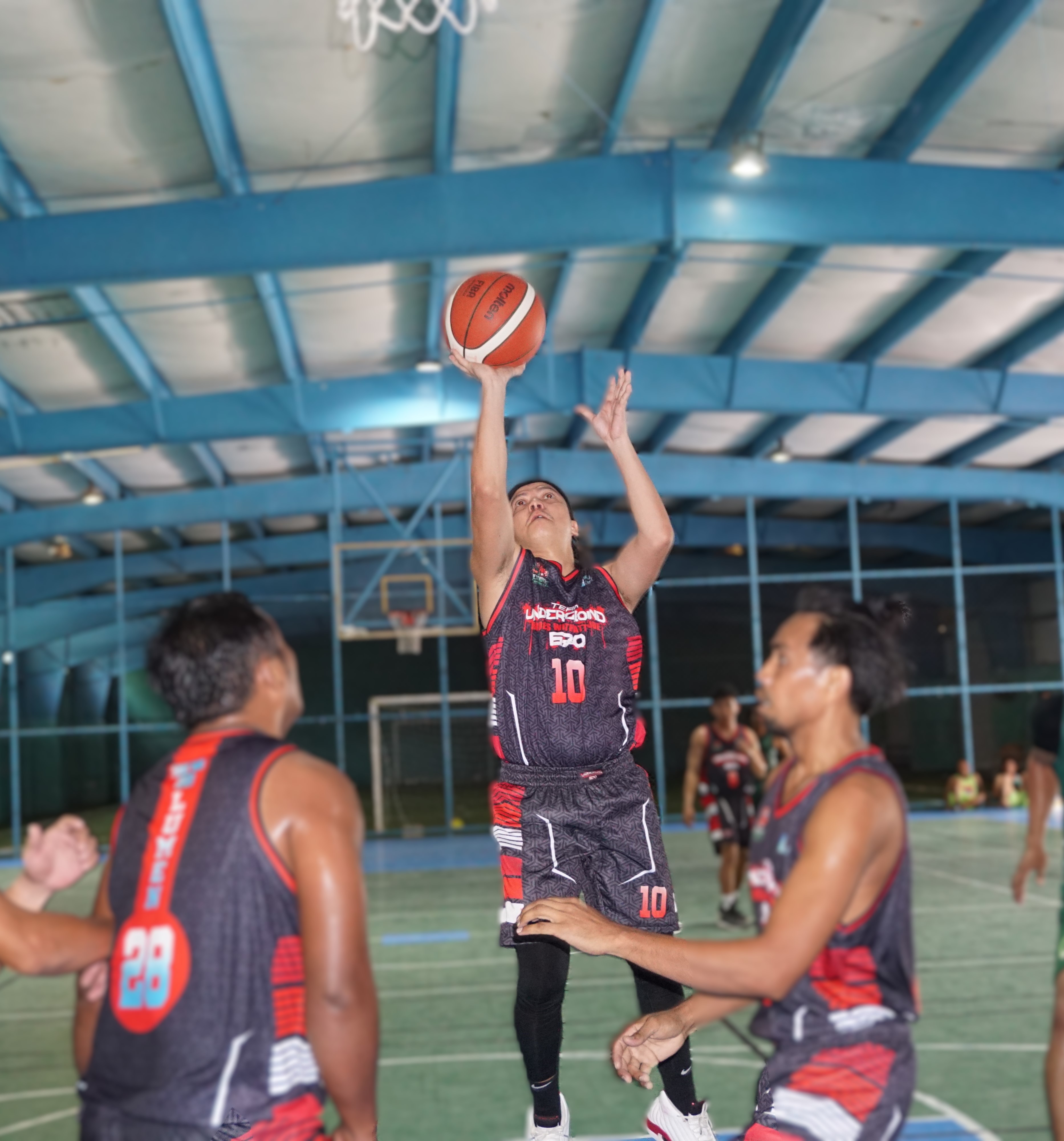 The Underground's Rhen Francisco pulls up for the open shot during an opening game of the Destroyers Basketball Club Invitational Basketball League at the TSL Sports Complex on Sunday.