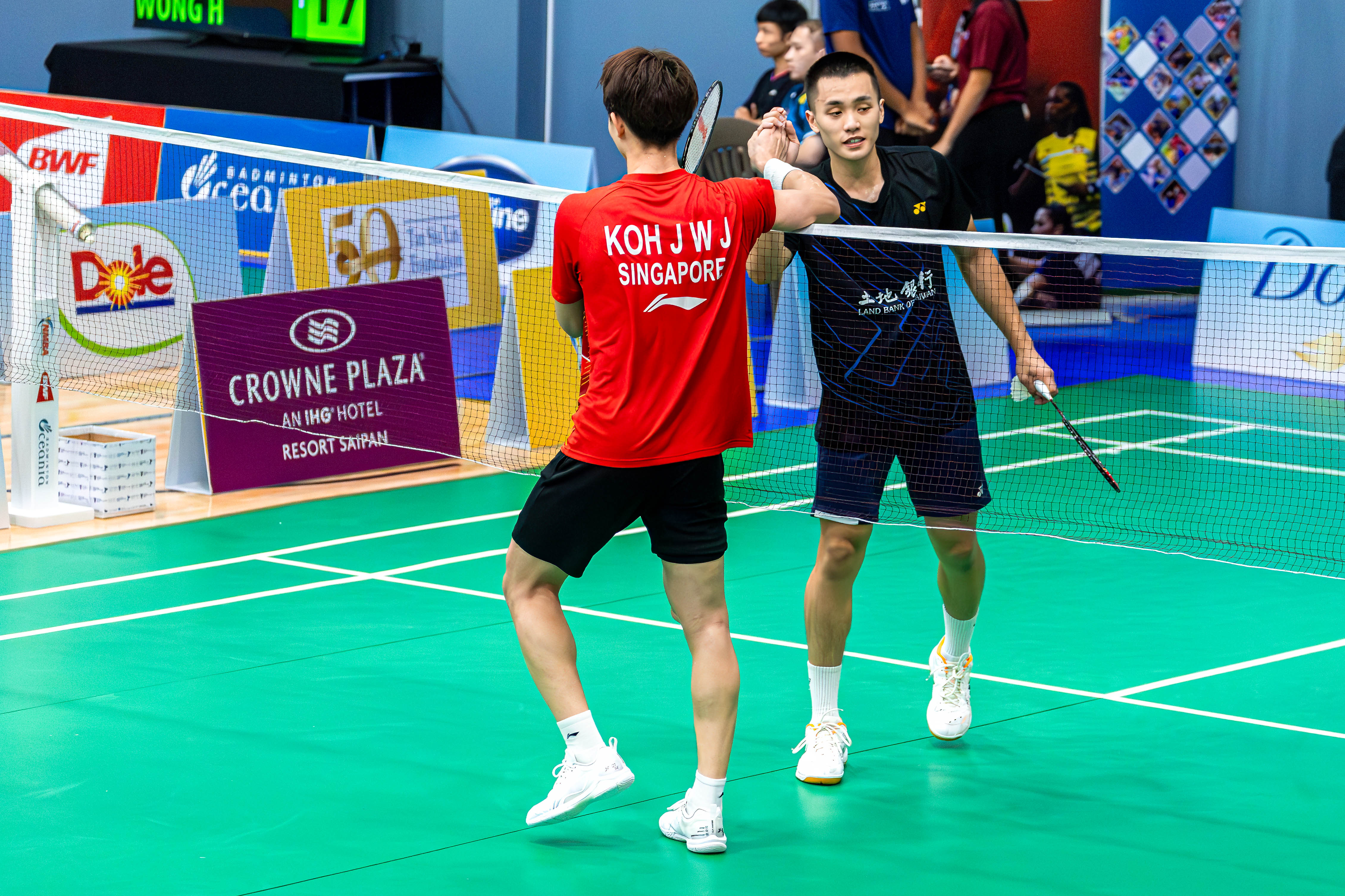 Singapore's Koh and Chinese Taipei's Liu show good sportsmanship after a grueling match that went to overtime.