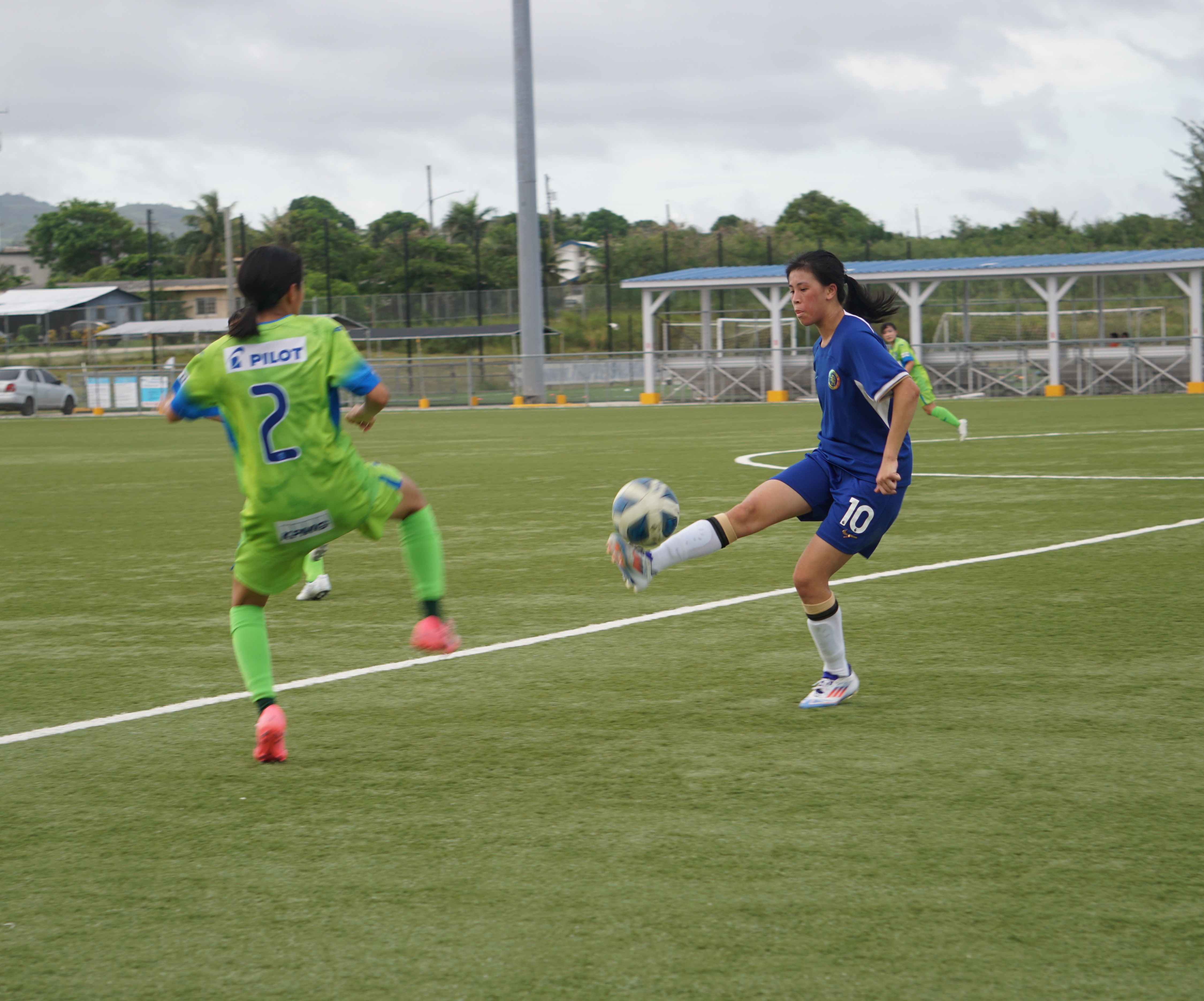 Chelsea Soccer School HK Women's Team's Leung Hong Kiu extends to control the possession during a 2024 LPK Cup match against the Shonan Bellmare FC U15 Girls Team at the NMI Soccer Training Center in Koblerville on Thursday.