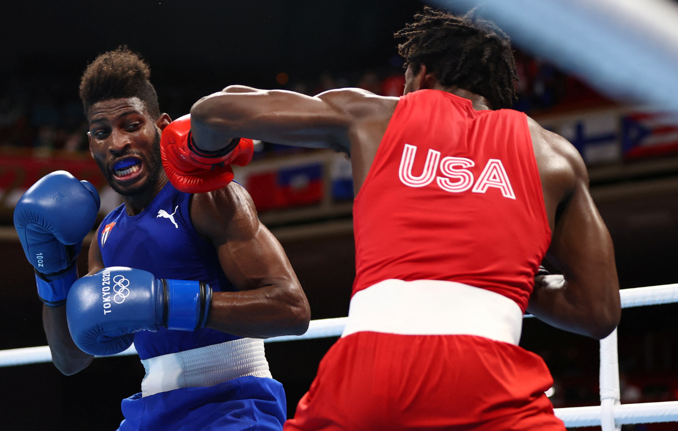Keyshawn Davis of the United States in action against Andy Cruz of Cuba in the Olympics men's lightweight final match at the Kokugikan Arena in Tokyo, Japan on Aug. 8, 2021.