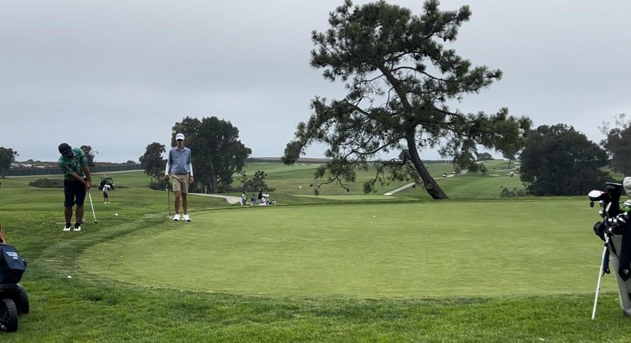 Zhi Yun Li, left, attempts a chip in birdie during round 1 of the IMG Academy Junior World Championships in San Diego, California held from July 9 to 11.