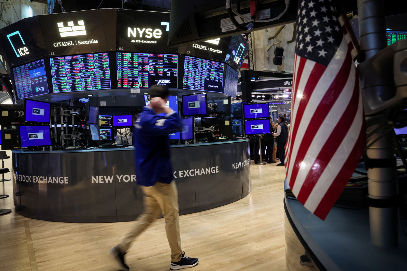 Traders work on the floor at the New York Stock Exchange in New York City, July 3, 2024.