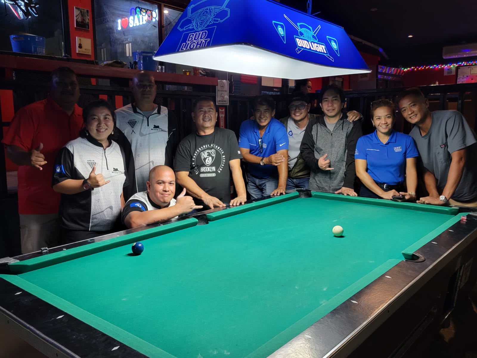 Black 8 Shake N' Break and Black 8 SCS Team players pose for a group photo after their match in the Thursday division of the SBA Budweiser Open 8-Ball League 2024 at the Black 8 Pool Bar on Thursday.