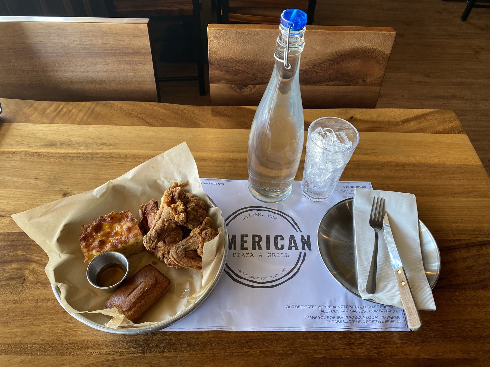 American Pizza & Grill serves fried chicken, honey cornbread, truffle mac and cheese and more.