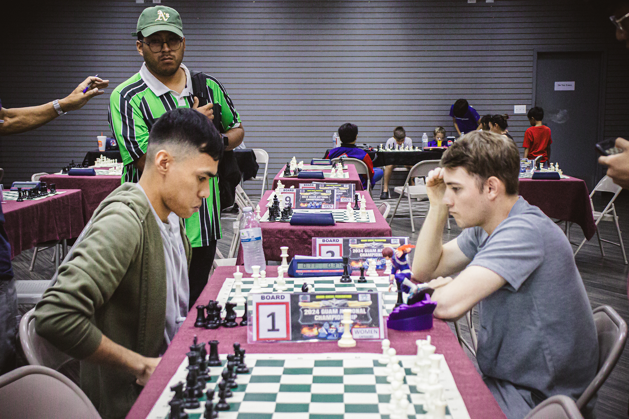 Chess players in action at a Micronesia Mall tournament.