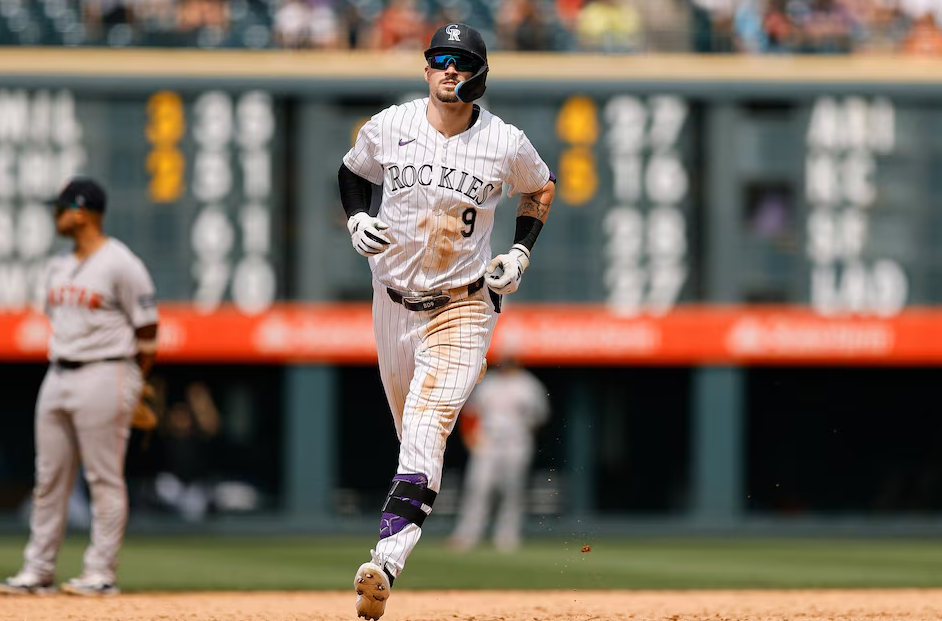 Colorado Rockies center fielder Brenton Doyle (9) rounds the bases on a grand slam in the sixth inning against the Boston Red Sox at Coors Field in Denver, Colorado, July 24, 2024.