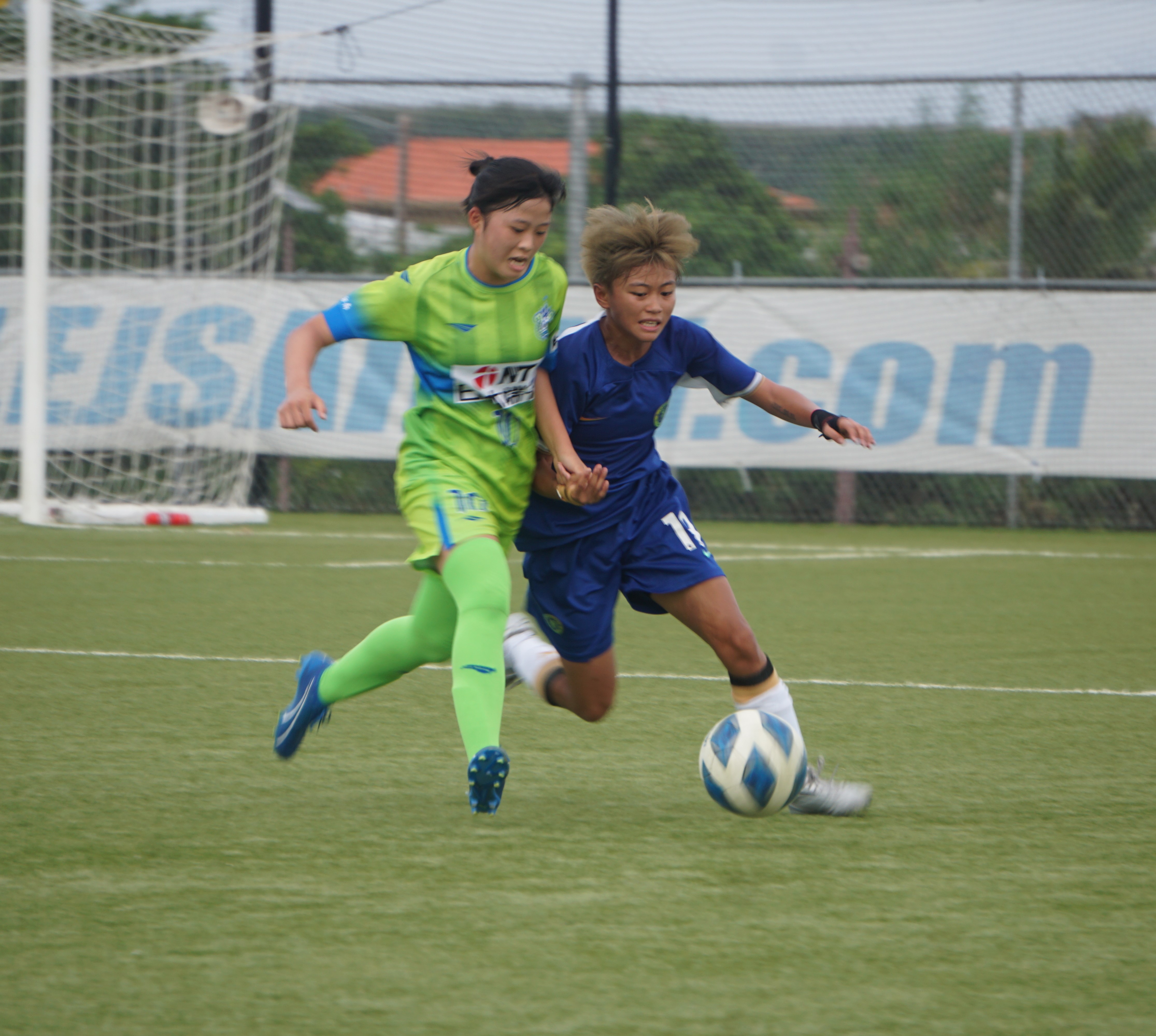 Chelsea Soccer School HK Women's Team's Tsan Lai Mae battles for possession against a player of the Shonan Bellmare FC U15 Girls Team during a 2024 LPK Cup match at the NMI Soccer Training Center in Koblerville on Thursday.