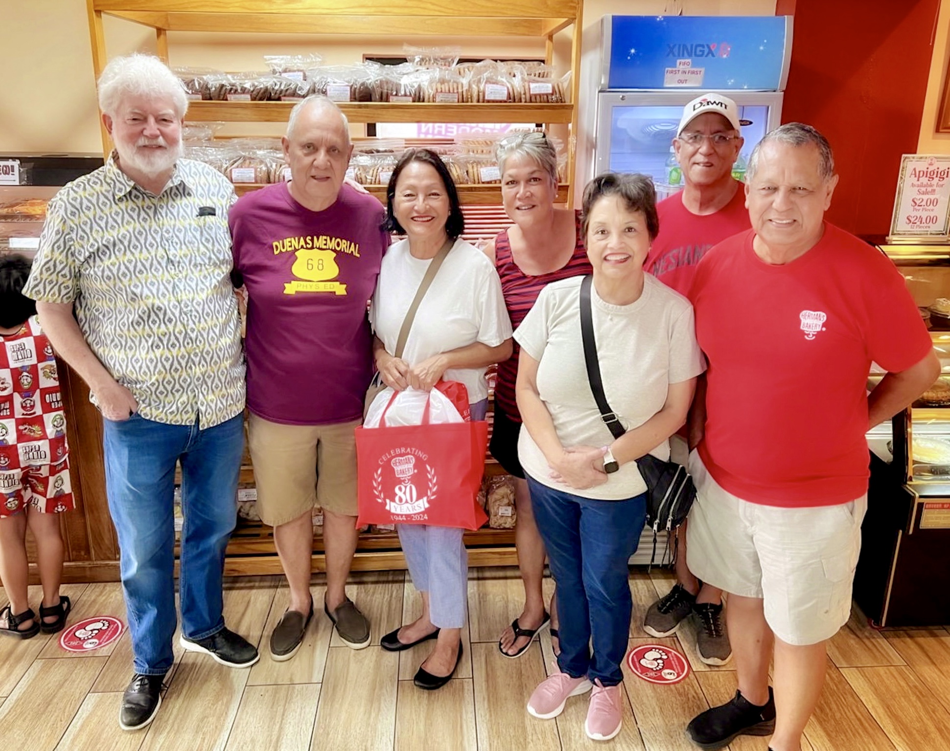 Herman’s Modern Bakery Inc. owners Herman “Junpan” T. Guerrero, Juan “Juanpan” T. Guerrero, Joseph “Leepan” T. Guerrero and wife Victoria pose for a photo with visiting Guam Gov. Lou Leo Guerrero, 3rd right, husband, attorney Jeff Cook, left, and staff member Catherine Flores, 3rd left. The Guam governor and her spouse congratulated the Pan family on the occasion of the 80th anniversary of Herman’s Modern Bakery Inc.