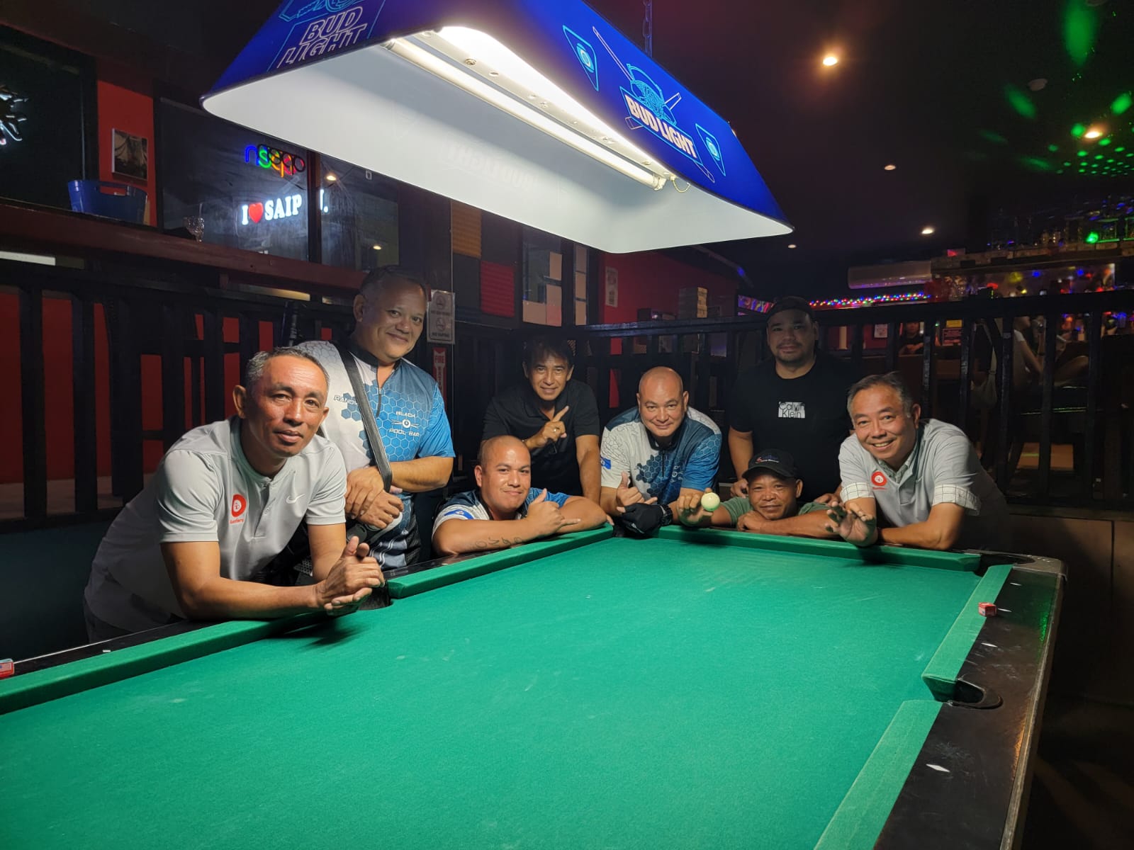 The Black 8 Ideal Signs Rustlers and the Black 8 Rack N Roll pose for a group photo during their debut in the Tuesday division of the SBA Budweiser Open 8-Ball League 2024 at the Last Shot Bar.