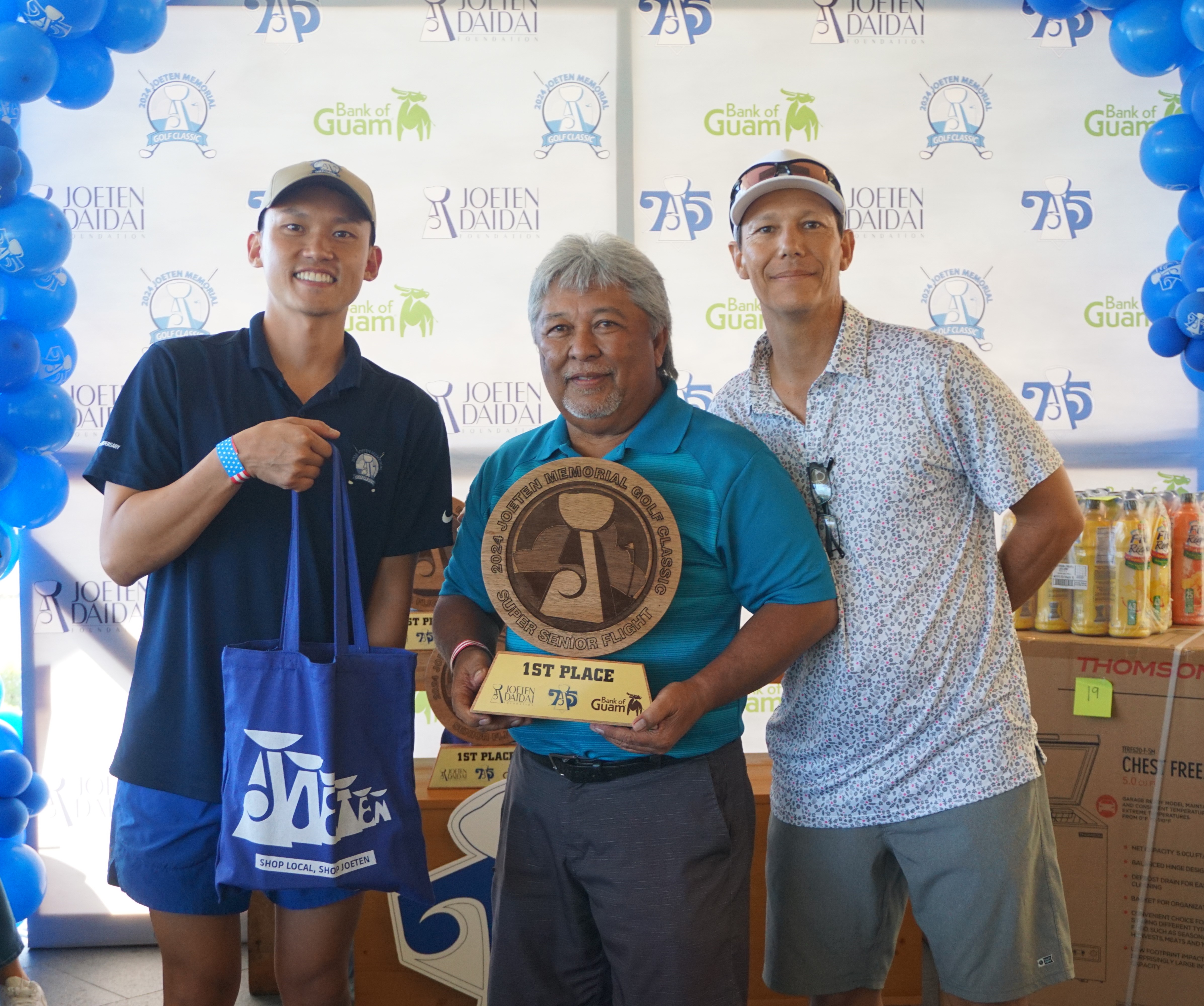 Joe Sablan Jr. poses with the Super Senior Flight trophy alongside Committee Chair Shigeki Tenorio, left, and Tournament Director Peter "Dung" Tenorio during the awards ceremony of the 2024 Joeten Memorial Classic at Laolao Bay Golf & Resort on Saturday.