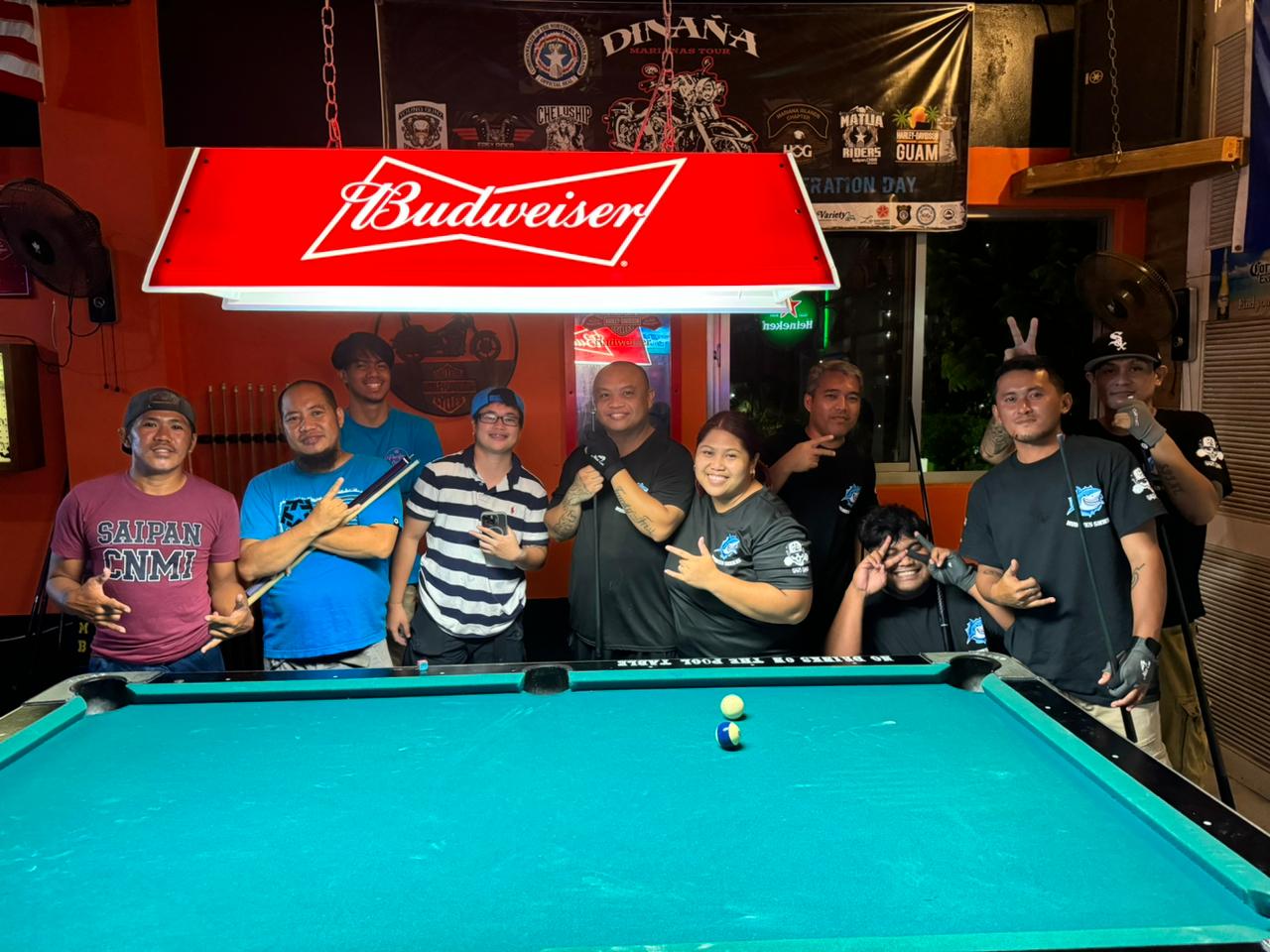 The Last Shot Hobbies Sharks and the Last Shot Fighters pose for a group photo during their debut in the Tuesday division of the SBA Budweiser Open 8-Ball League 2024 at the Last Shot Bar.