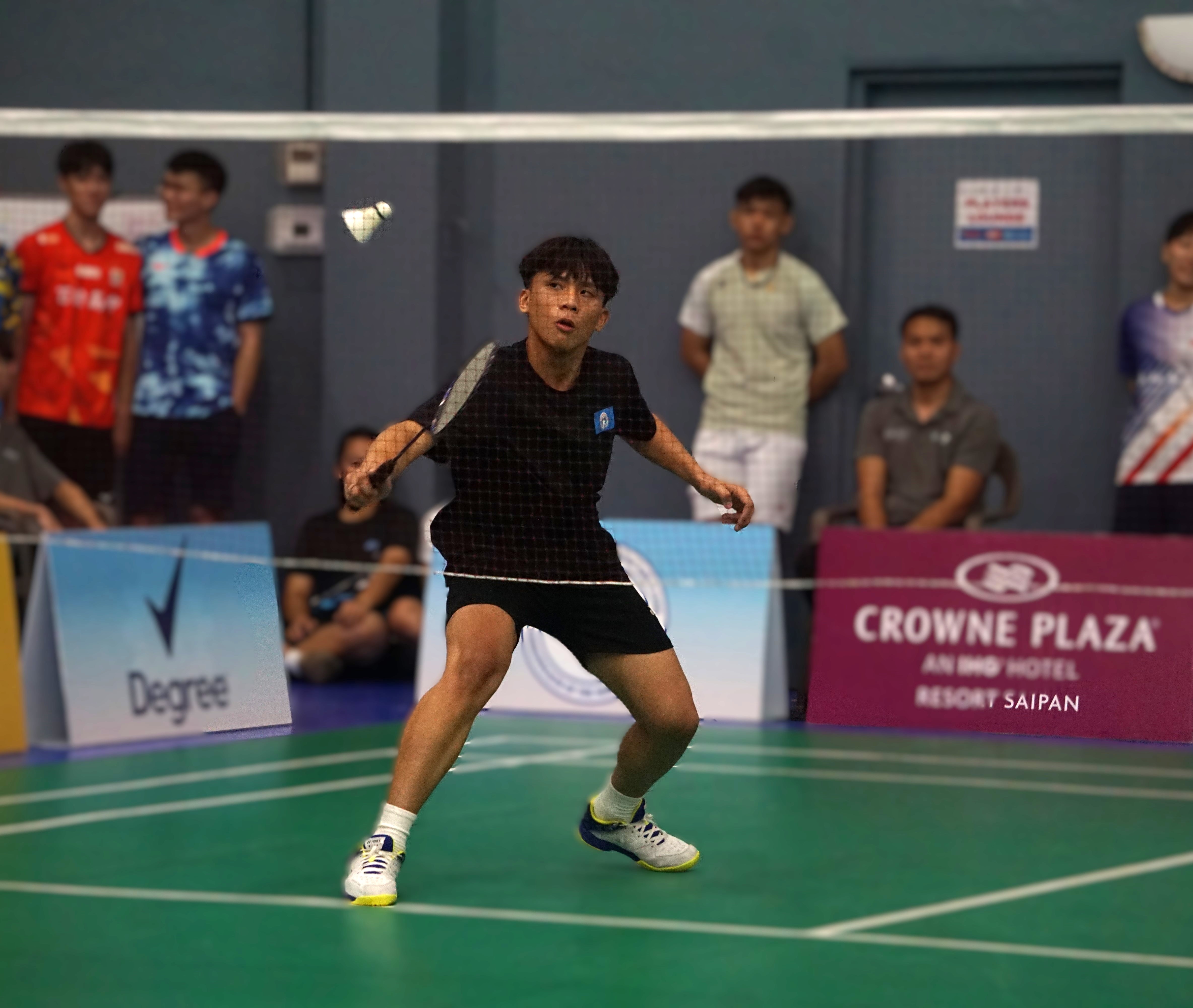 The NMI's Ean Camacho reaches for the backhand return during a men’s singles match against Chinese Taipei’s Chu Chen Jia in the Crowne Plaza Northern Marianas Open 2024 at the Ada gym Tuesday.