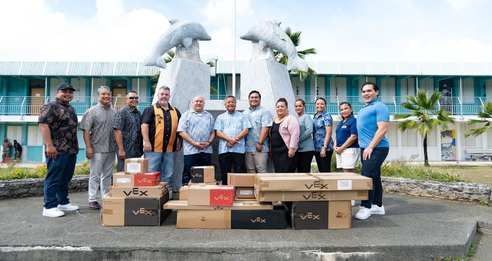 From left, Preston Basa, Marianas High School vice principal; Frank Ada, HR Director, Triple J; Fred Camacho, business development manager, Triple J; Mario Valentino, senior superintendent, Triple J; Dr. Lawrence Camacho, education commissioner; Mike Sablan, vice president, Triple J; Jose Mafnas Jr., corporate counsel, Triple J; Melanie Sablan-Rdiall, vice principal; Deanna Reyes, Surfrider Hotel manager; Kina Peter, CPA, corporate controller, Triple J; Dr. Marifi Doculan, Dolphins Robotics Club advisor; and A. Romolo Orsini, MHS vice principal.