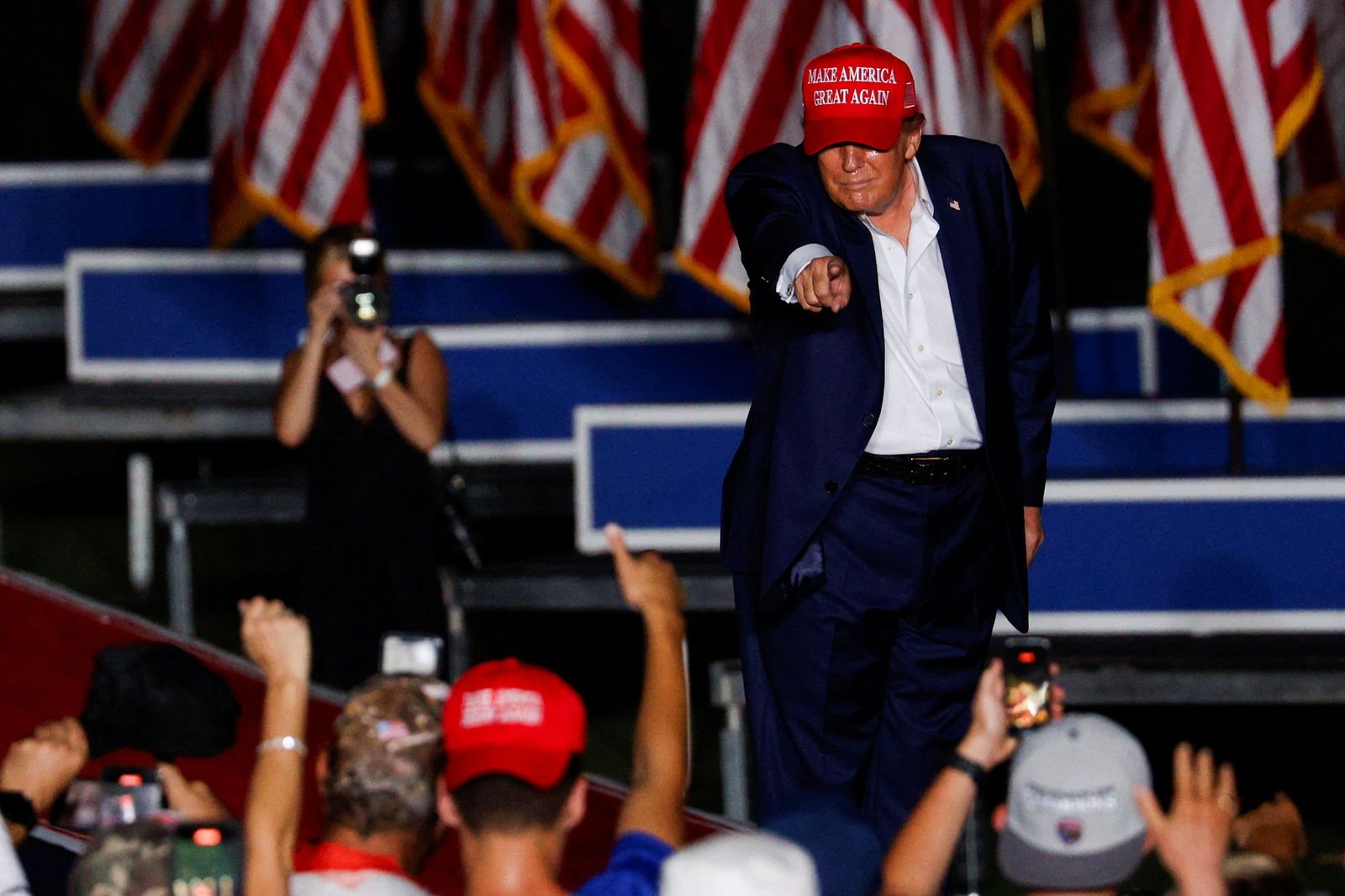Republican presidential candidate Donald Trump points towards his supporters during a campaign rally at his golf resort in Doral, Florida, July 9, 2024.