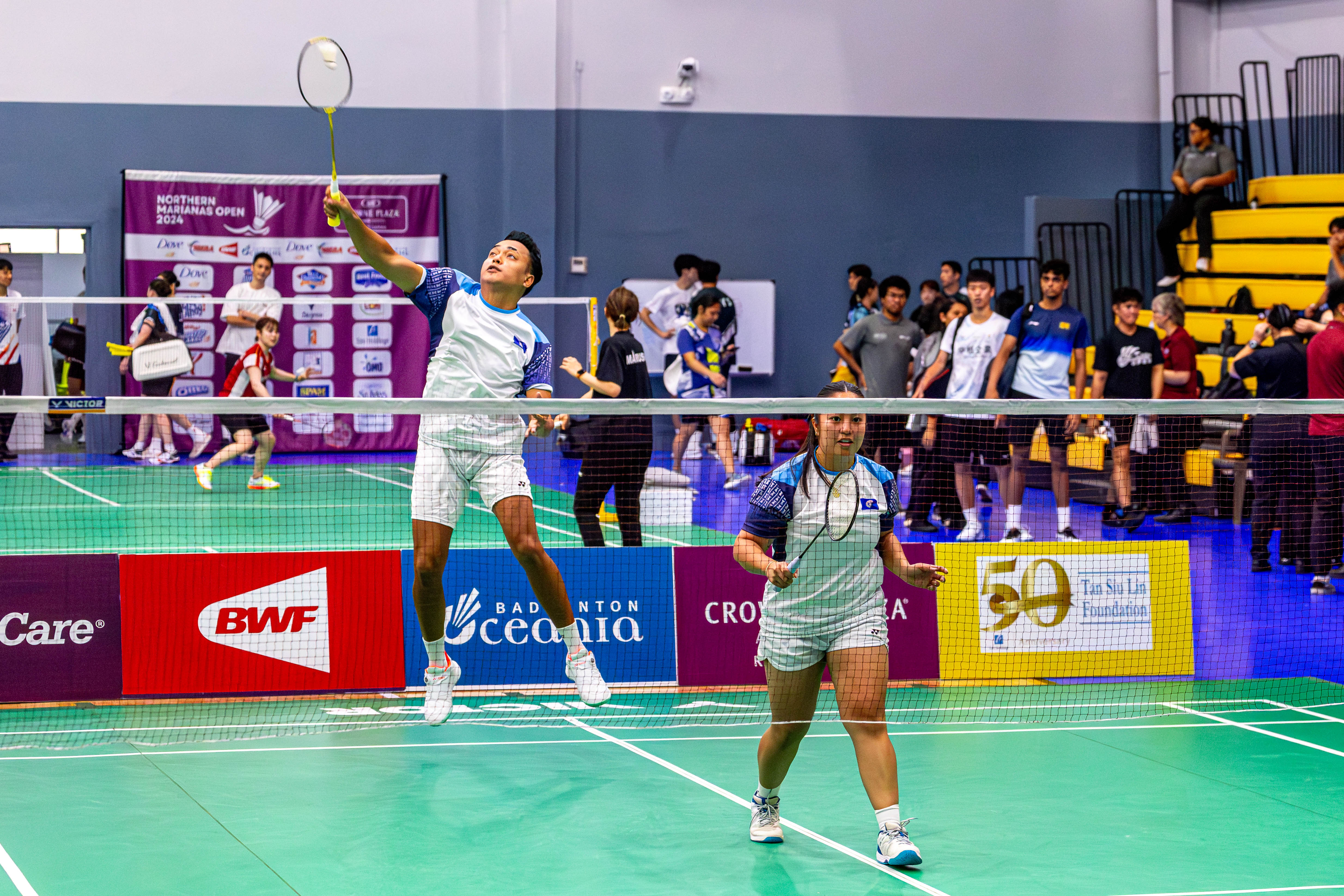The NMI's Nate Guerrero leaps for the return as teammate Janelle Pangilinan sets up her defense during a Mixed Doubles match against Japan in the Crowne Plaza Northern Marianas Open 2024 at the Ada gym on Wednesday.