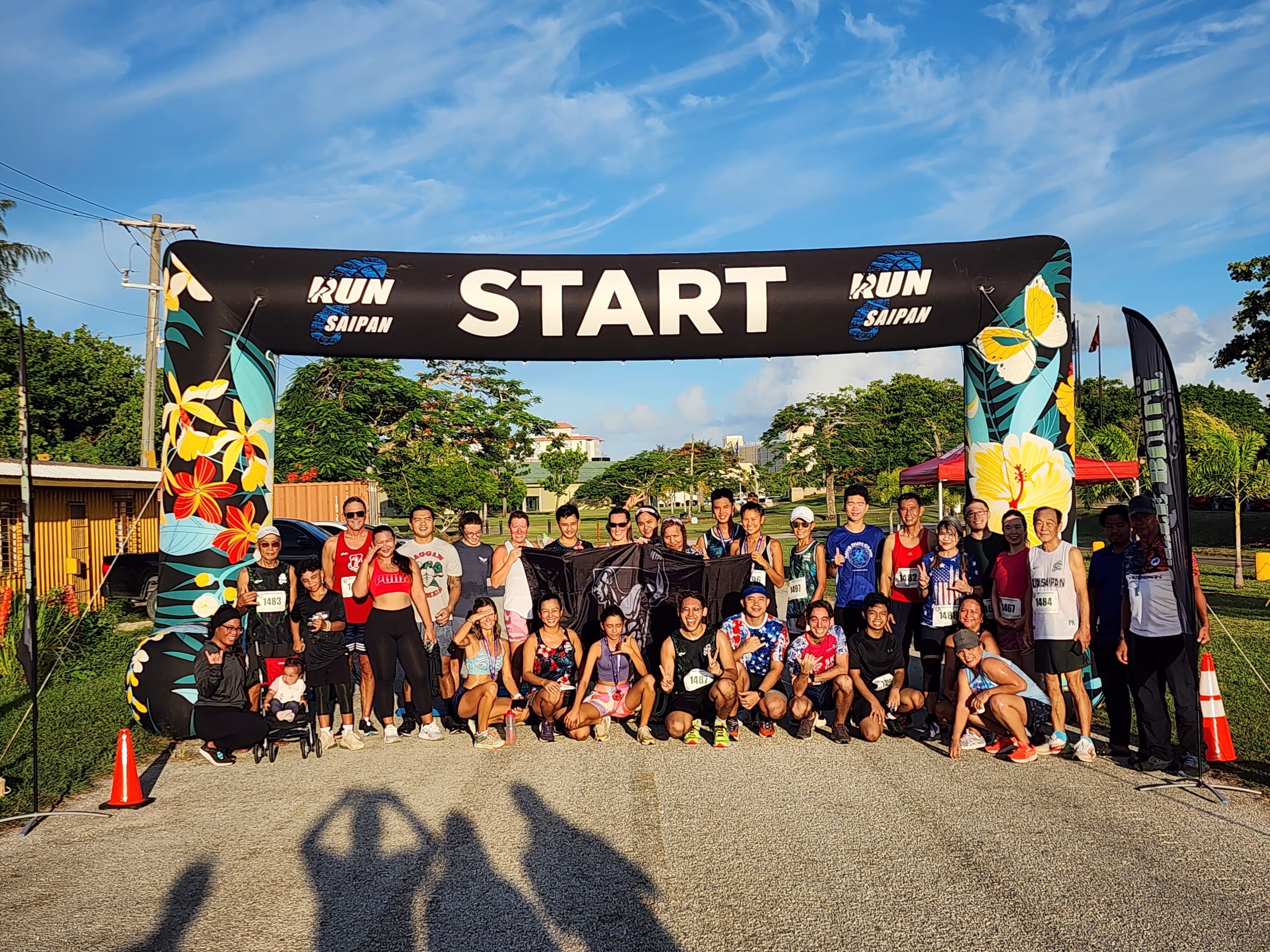 The participants of the Run Saipan’s 4th Annual 4th of July Independence Day 2-mile Race pose for a photo on Thursday morning.