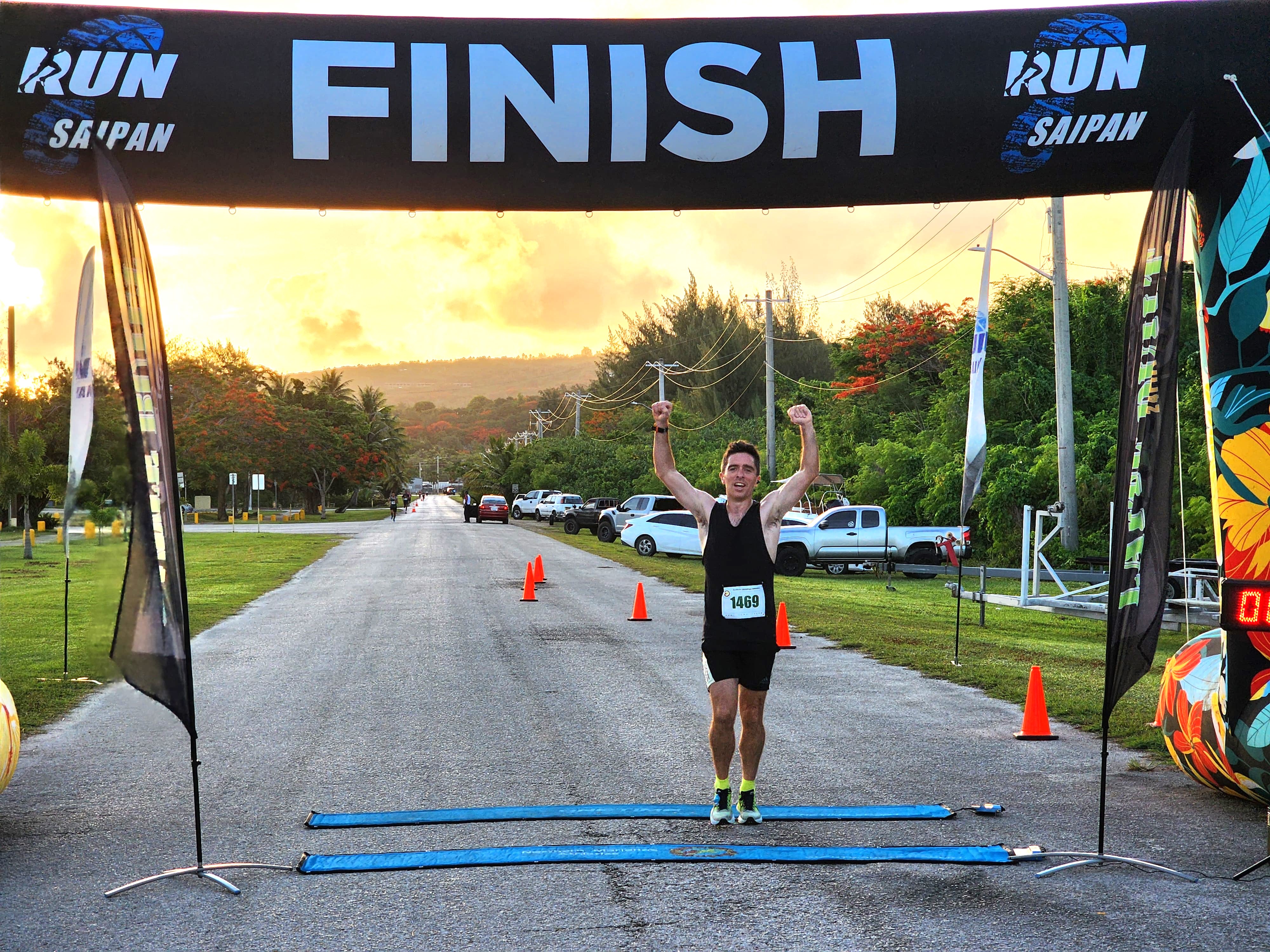 Jody O'Sullivan celebrates as he finishes first overall in Run Saipan’s 4th Annual 4th of July Independence Day 2-mile Race at Smiling Cove Marina on Thursday morning.