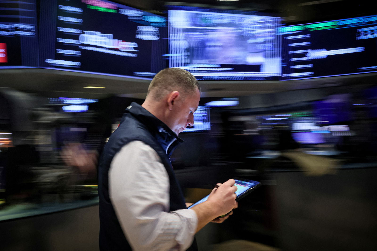 A trader works on the floor at the New York Stock Exchange in New York City, March 7, 2024.