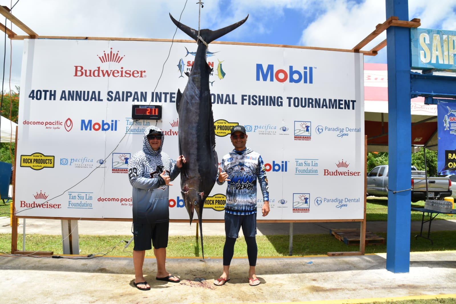 Only Reels Captain Aaron Benavente, right, and angler Jesse Ramon pose with their winning catch — a 211-pound billfish — on day 2 of the Saipan Fishermen's Association's 40th Annual Saipan International Fishing Derby held over the weekend at the Smiling Cove Marina.