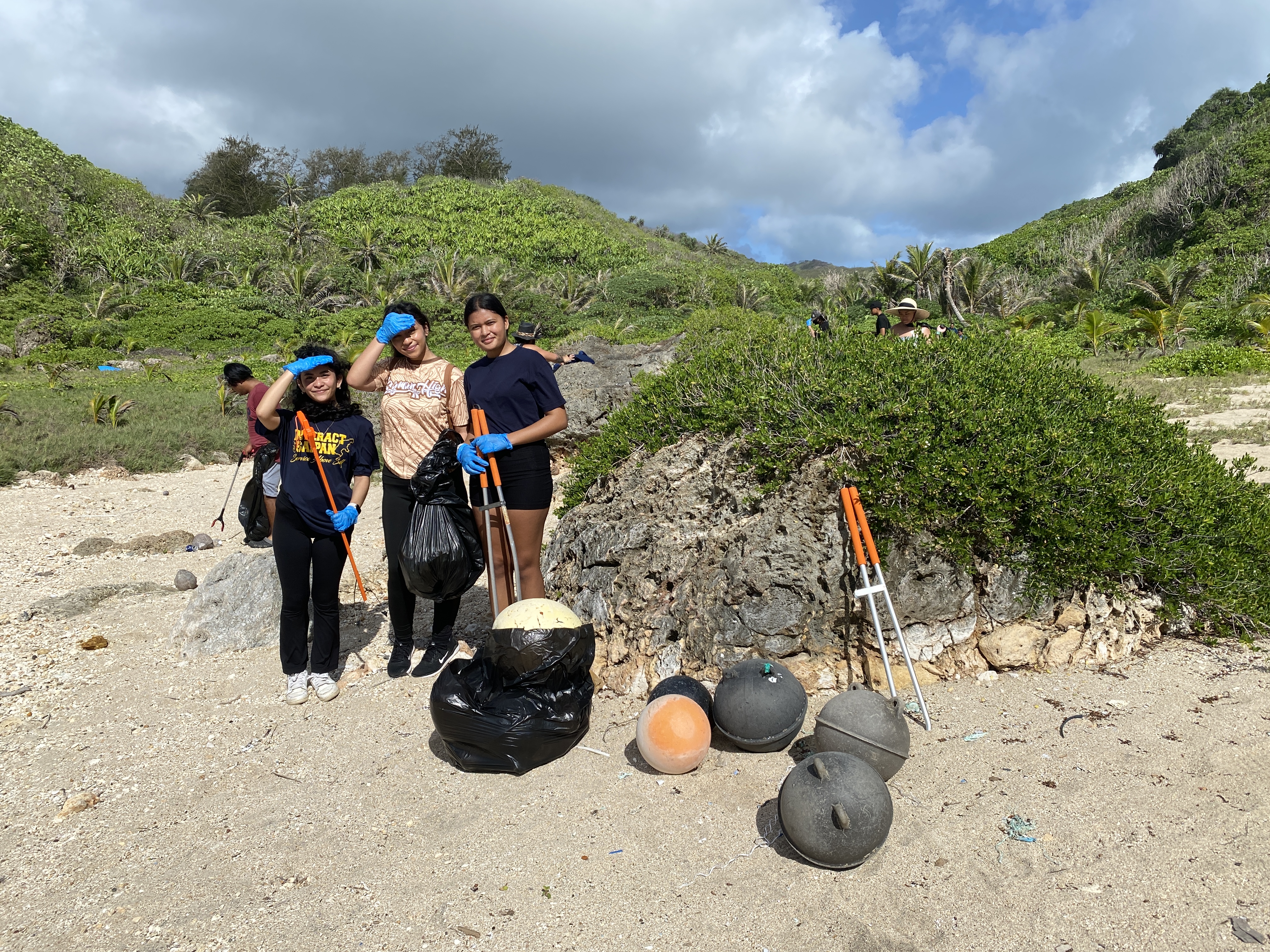 Cleanup volunteers take a break to pose for a photo.  