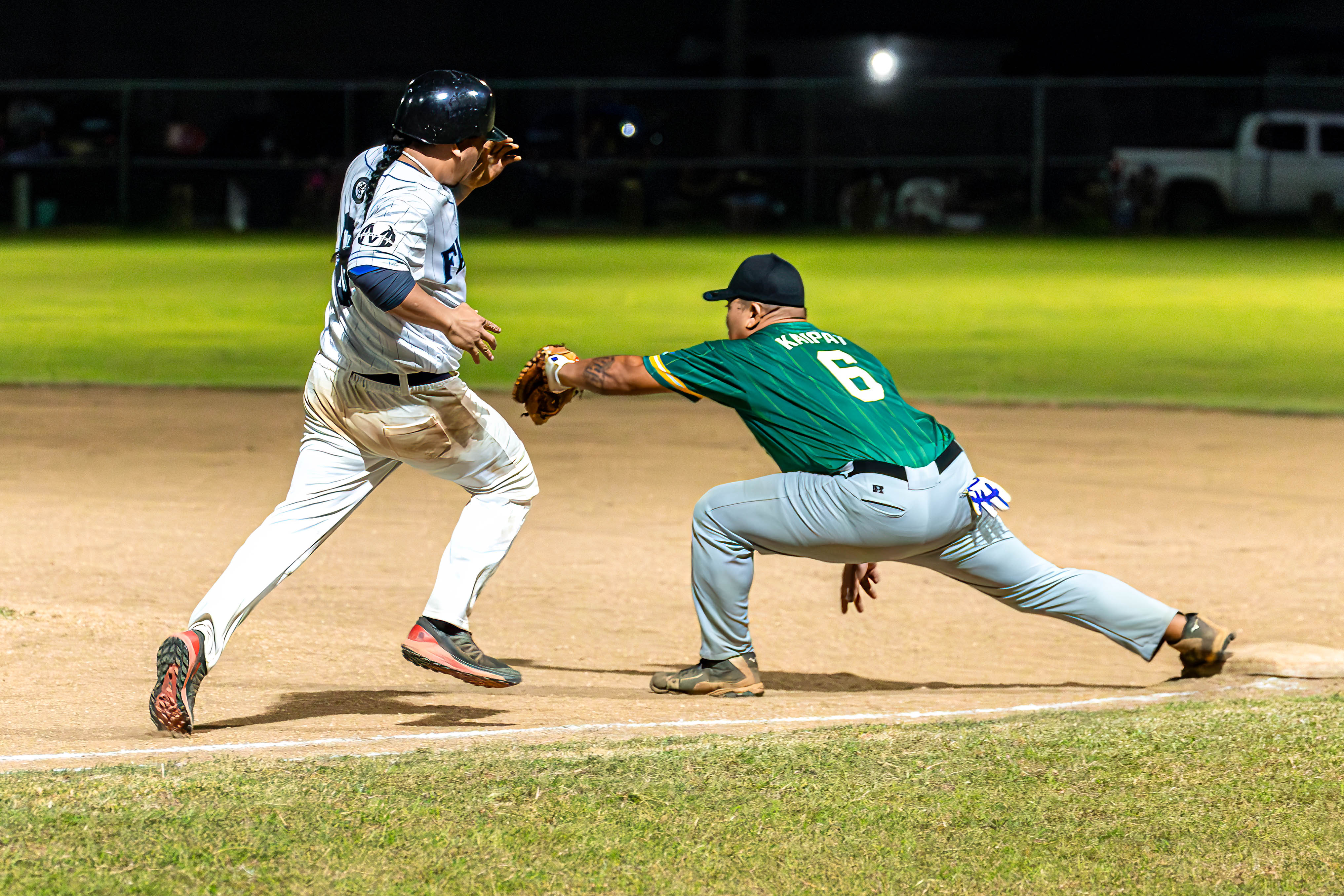 Sandlot first baseman Byron Kaipat reaches to tag a runner for an out during a game against the Falcons in the 2024 Tan Holdings Saipan Baseball League at the Francisco "Tan Ko" Palacios Baseball Field on Tuesday.