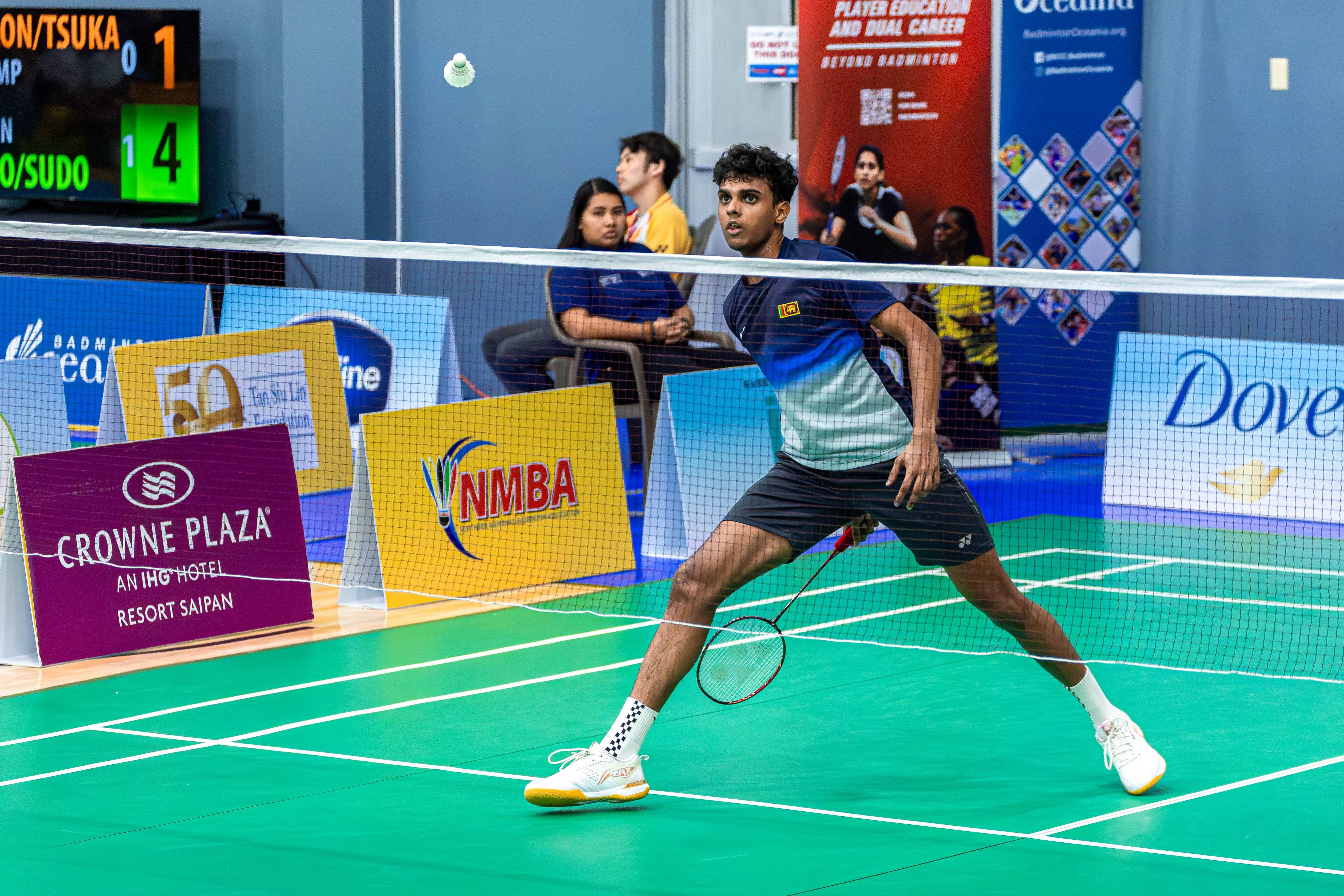Sri Lanka's Viren Nettasinghe connects a return from between his legs during a round 2 match against Chen Chi Ting in a men's singles match of the Dove Saipan International 2024 at the Ada gym Wednesday.