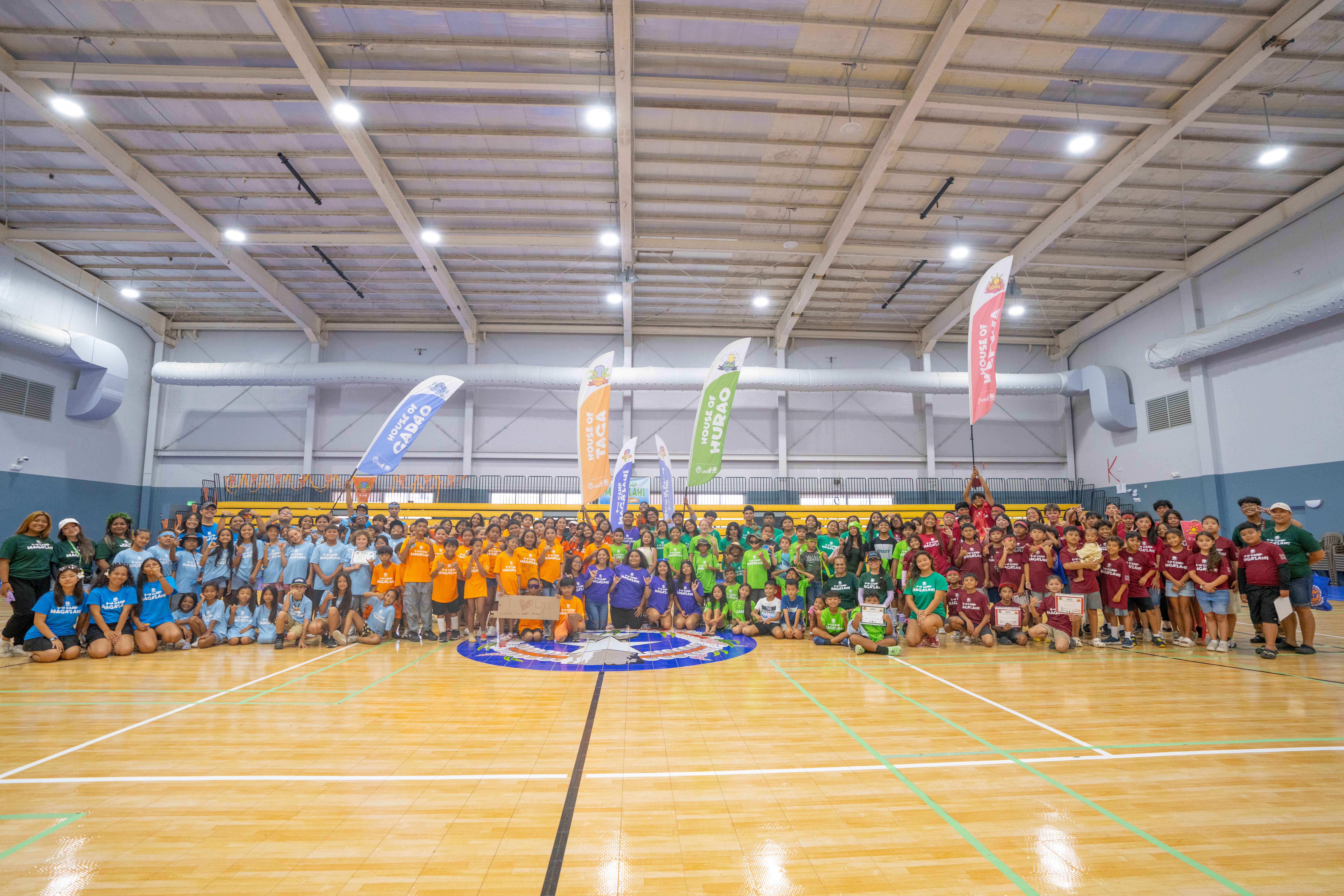 Campers and counselors in their respective houses gather for a group photo on the last day of 4-H Camp Maga'lahi’s first Saipan Juniors Session.
