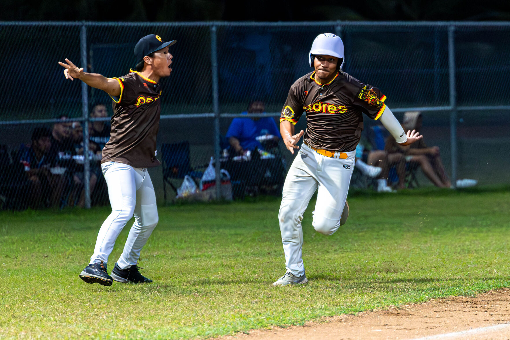 The Padres' Austin Benavente sprints home to score a run during a game against the Falcons in the 2024 Tan Holdings Saipan Baseball League at the Francisco "Tan Ko" Palacios Baseball Field on Wednesday.