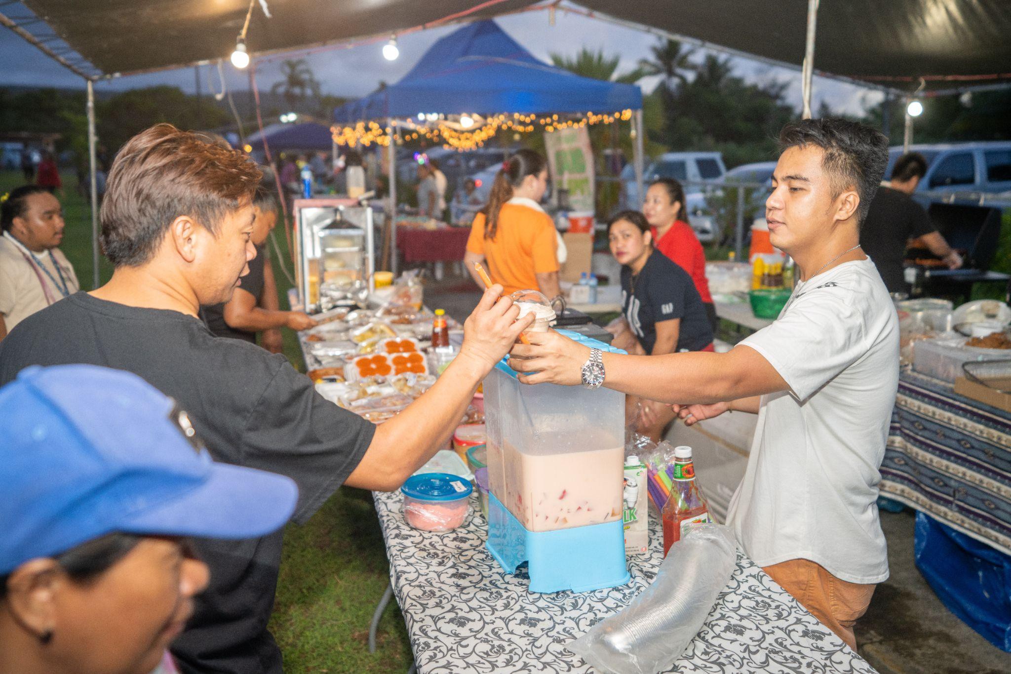 Residents from Rota enjoy treats from PJM Enterprise at the Rota SBDC Christmas In July event.