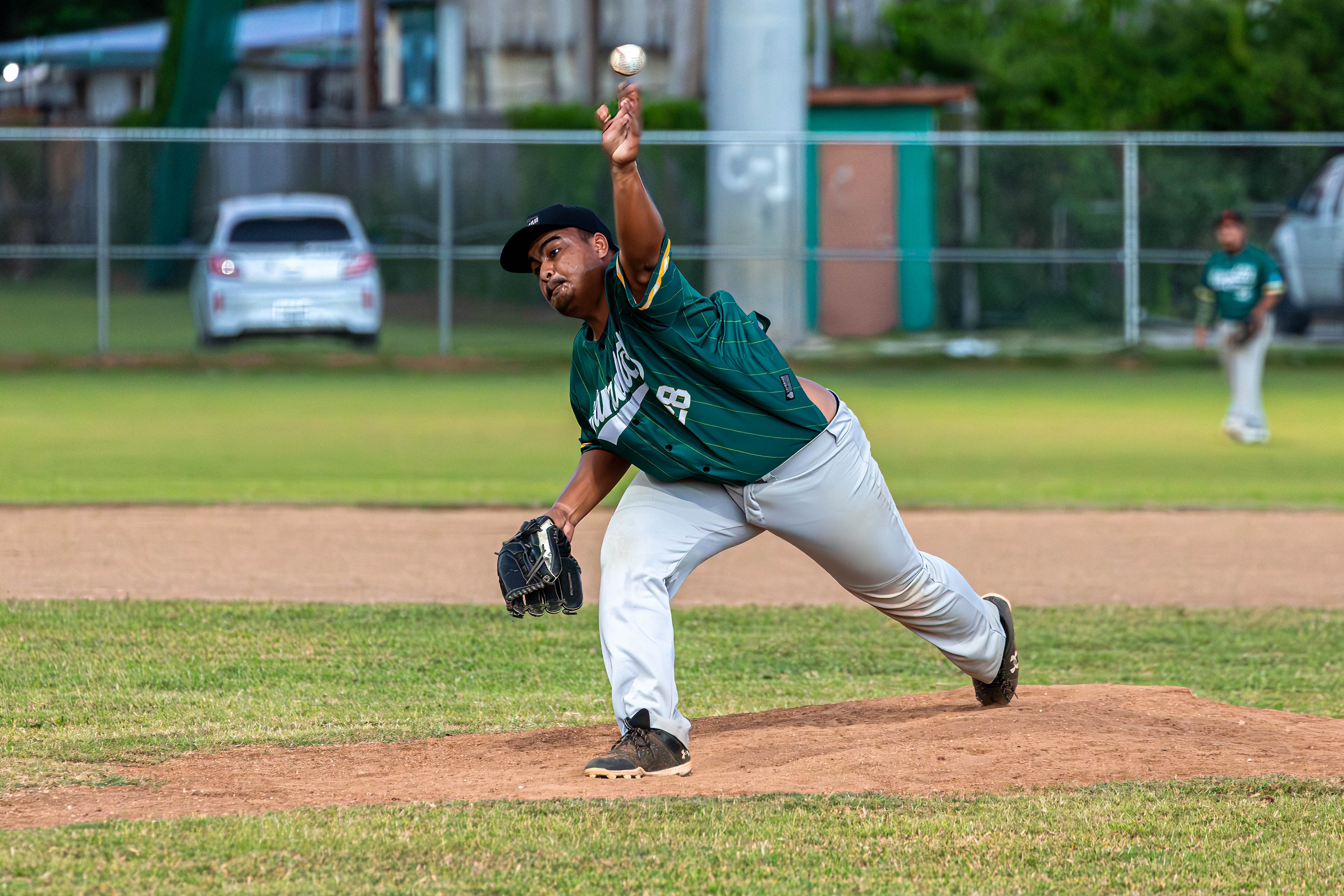 Sandlot's Pitcher Reid Teregeyo throws a pitch against the Falcons.