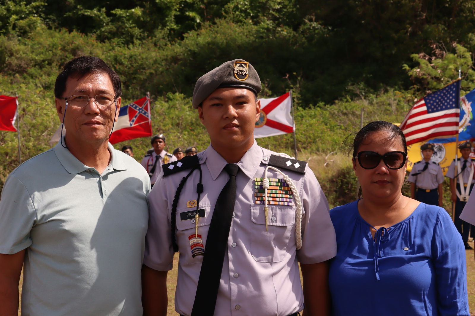 Former Stallion Battalion Commander Edward Tirona with his parents.