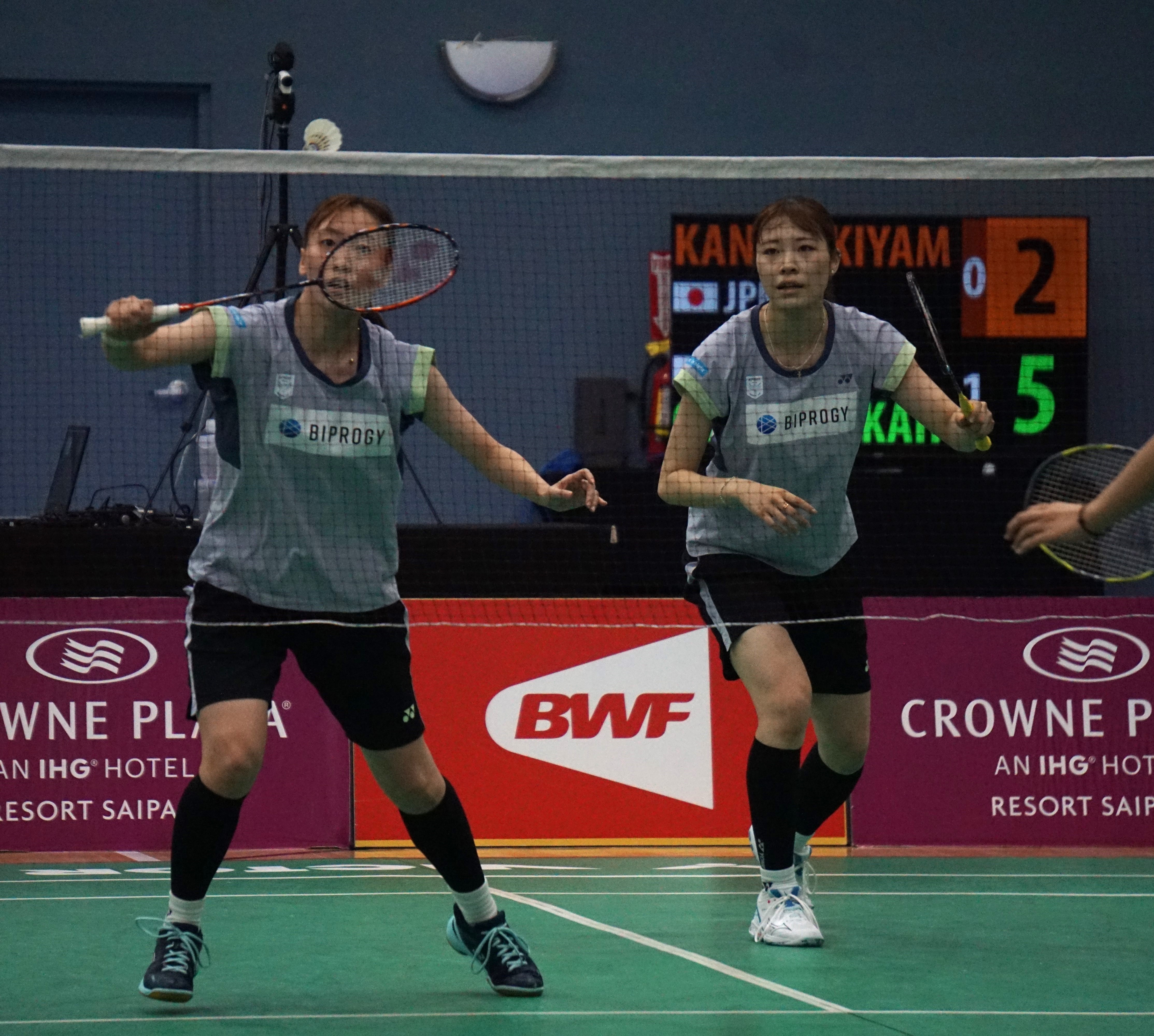 Mizuki Otake reaches for the backhand return as teammate Miyu Takahashi prepares to defend during the Crowne Plaza Northern Marianas Open women’s doubles finals match against Miki Kanhiro and Rui Kiyama at the Ada gym on Sunday.