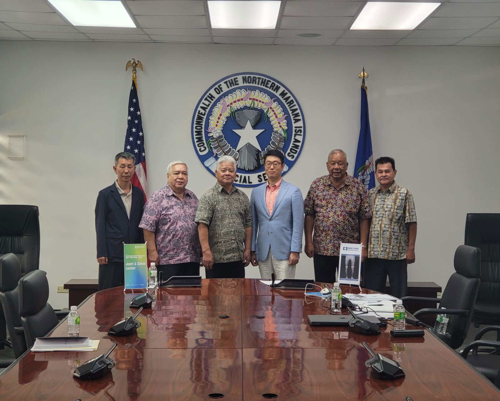 Gov. Arnold I. Palacios, third left, and Lt. Gov. David M. Apatang, second right, pose for a photo with Kang Dong Orthopedic Hospital Vice President Sharky Kang, third right, and International Healthcare Director Shon Park, left. Joining them are Health Network Program's Ronald Sablan, second left, and the special assistant to the lt. governor, Henry Hofschneider.
