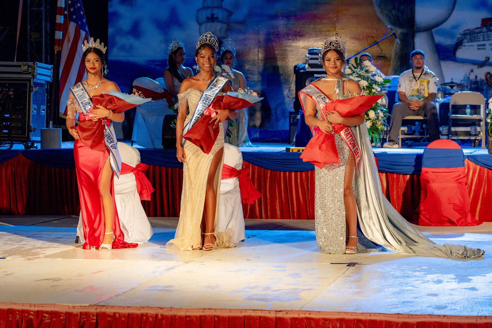 From left, 1st Runner-Up Nakisha Celis, Royal Princess Chariane Dabney, and 2024 Liberation Queen Xeayda Manglona pose on their coronation night at the Liberation Day festival grounds in Garapan on Tuesday, July 2. 