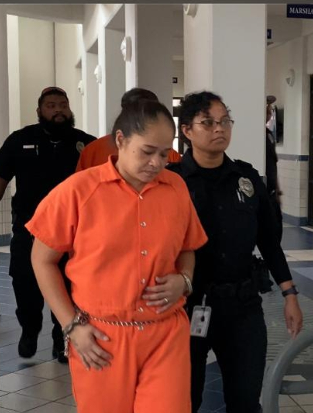 Ilayza Sanchez Matagolai is escorted by a Corrections officer to a bail hearing at the local courthouse on Friday morning.