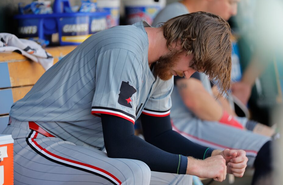Minnesota Twins starting pitcher Bailey Ober (17) sits in dugout in the ninth inning against the Detroit Tigers at Comerica Park in Detroit, Michigan, July 28, 2024.